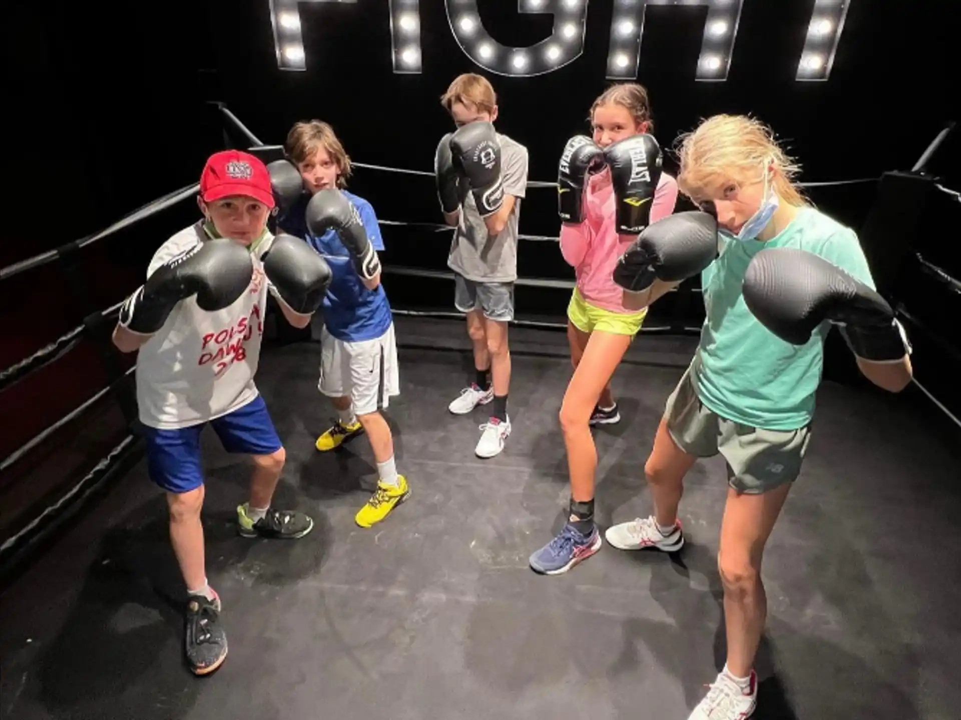 a group of people in a boxing ring