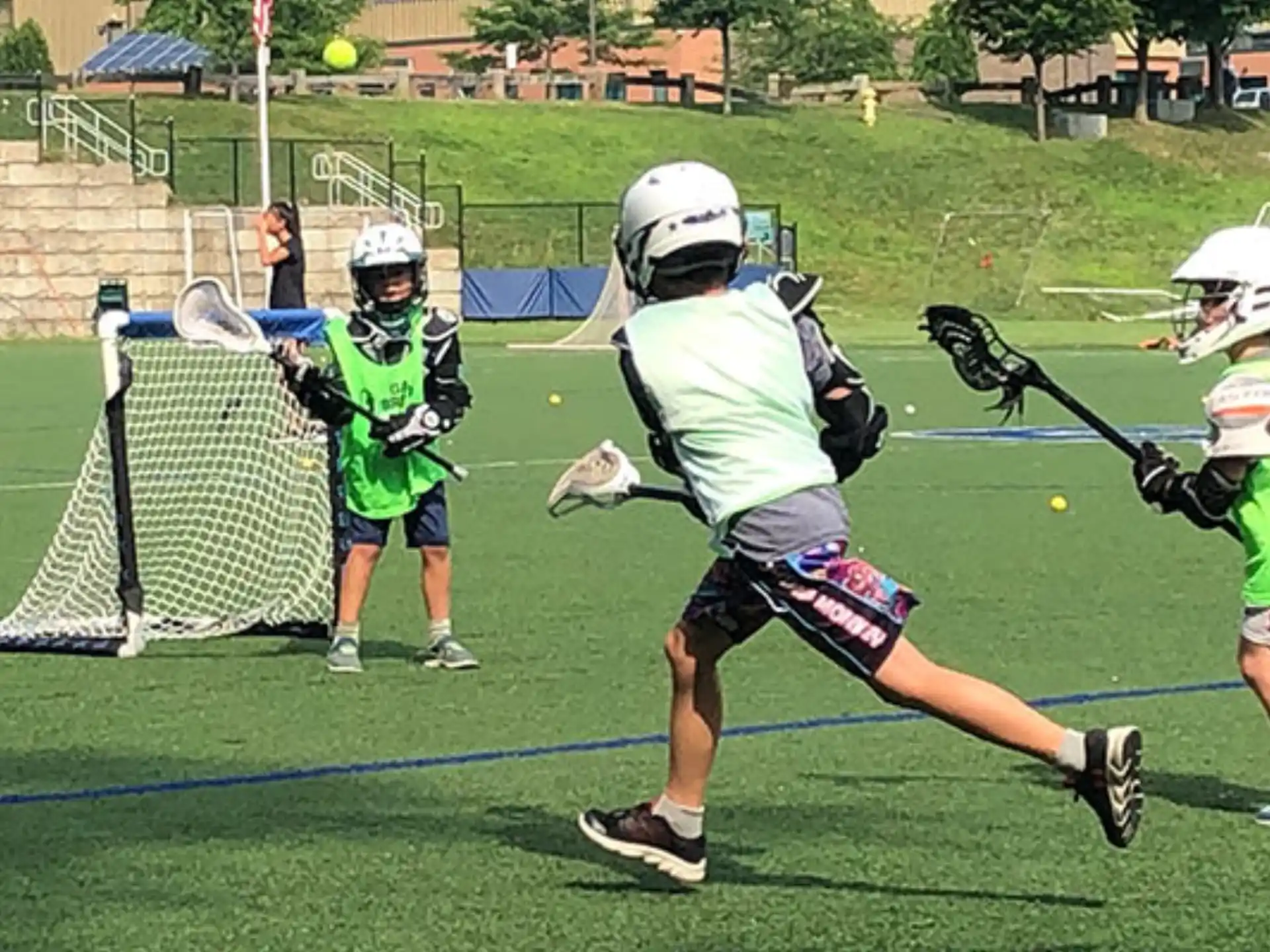 a group of people playing lacrosse
