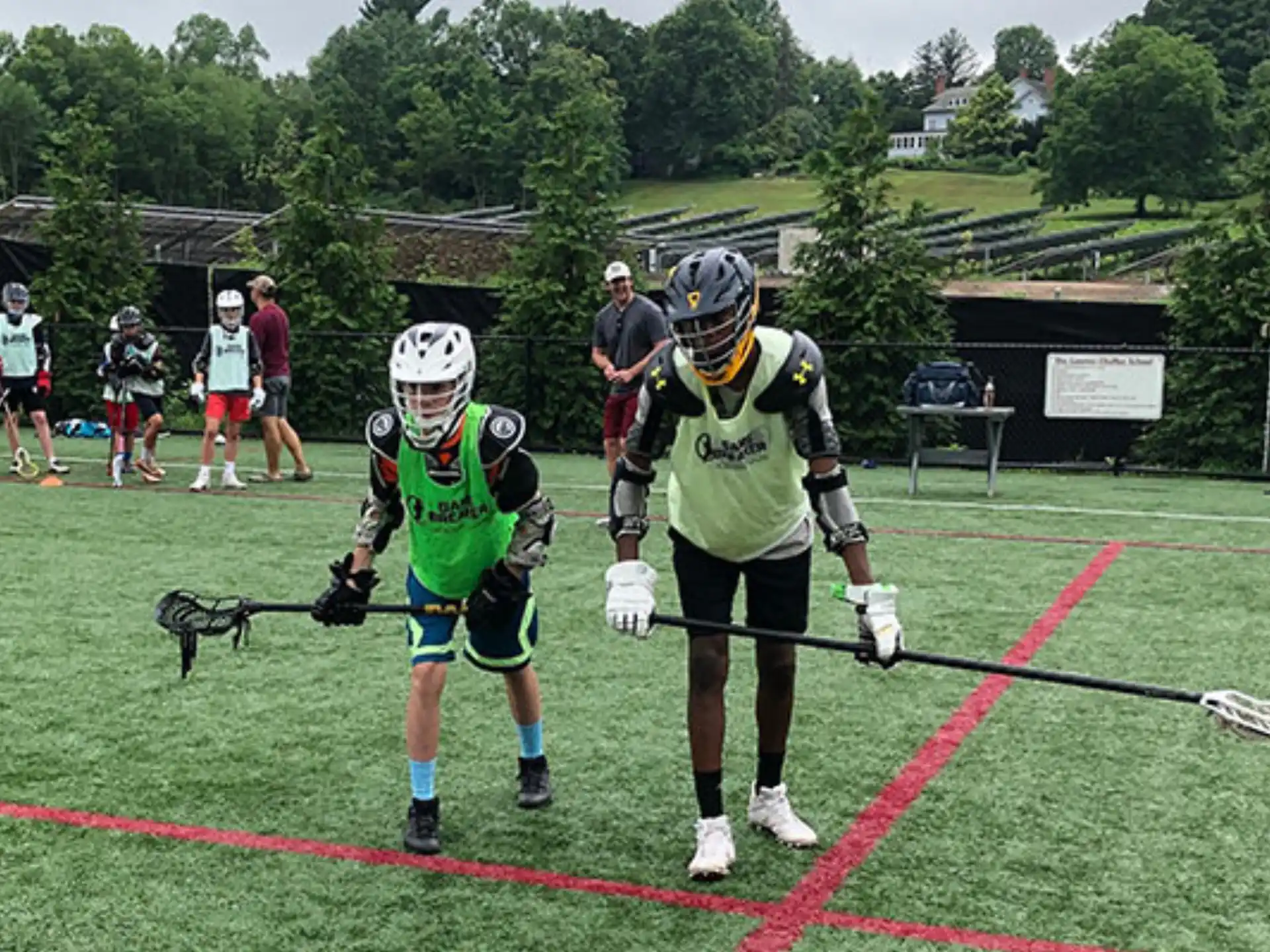 a group of people playing lacrosse