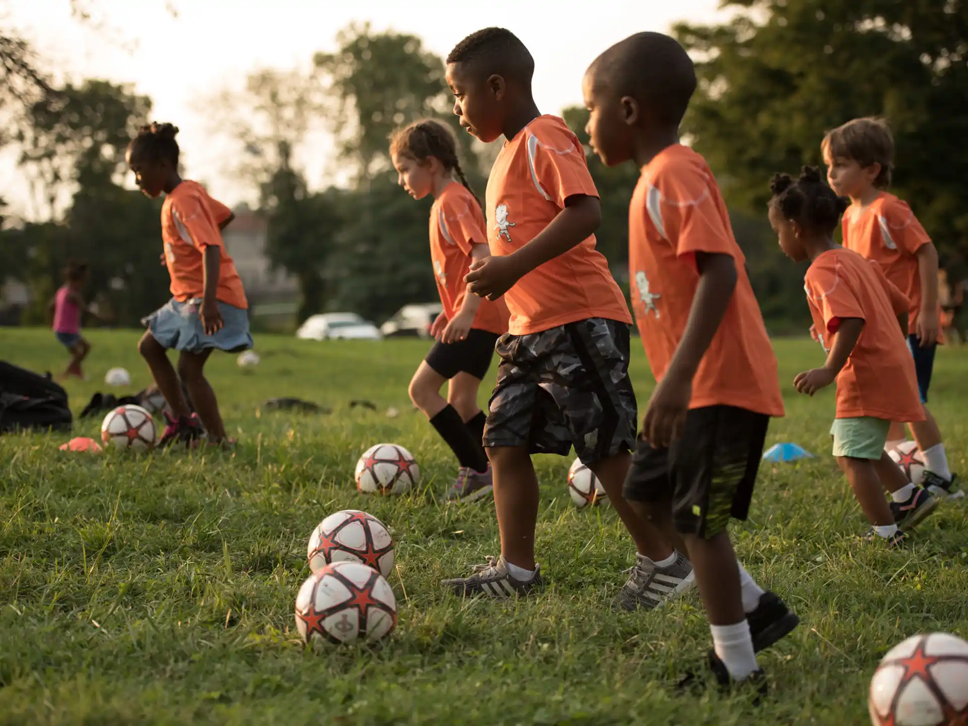 a group of kids playing football