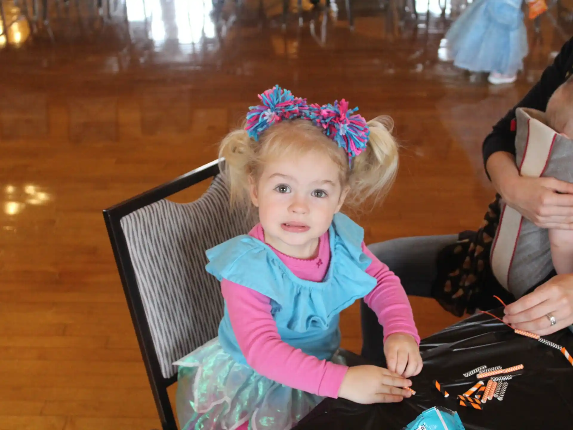 a little girl sitting in a chair