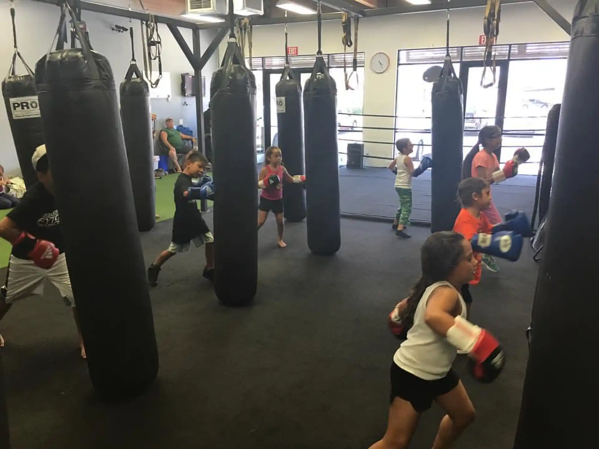 a group of people exercising in a gym