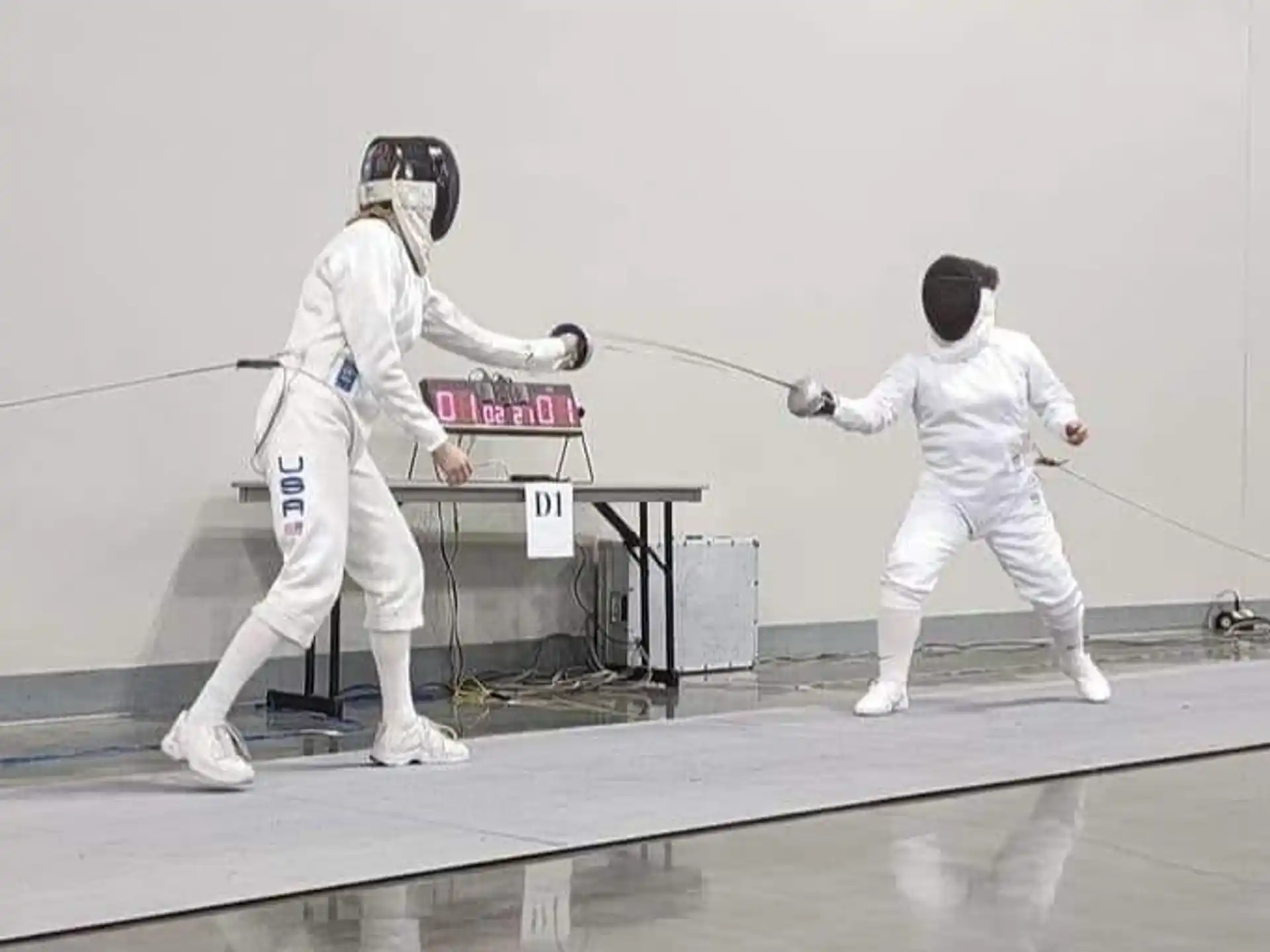 a couple of people in white uniforms holding swords and a sword