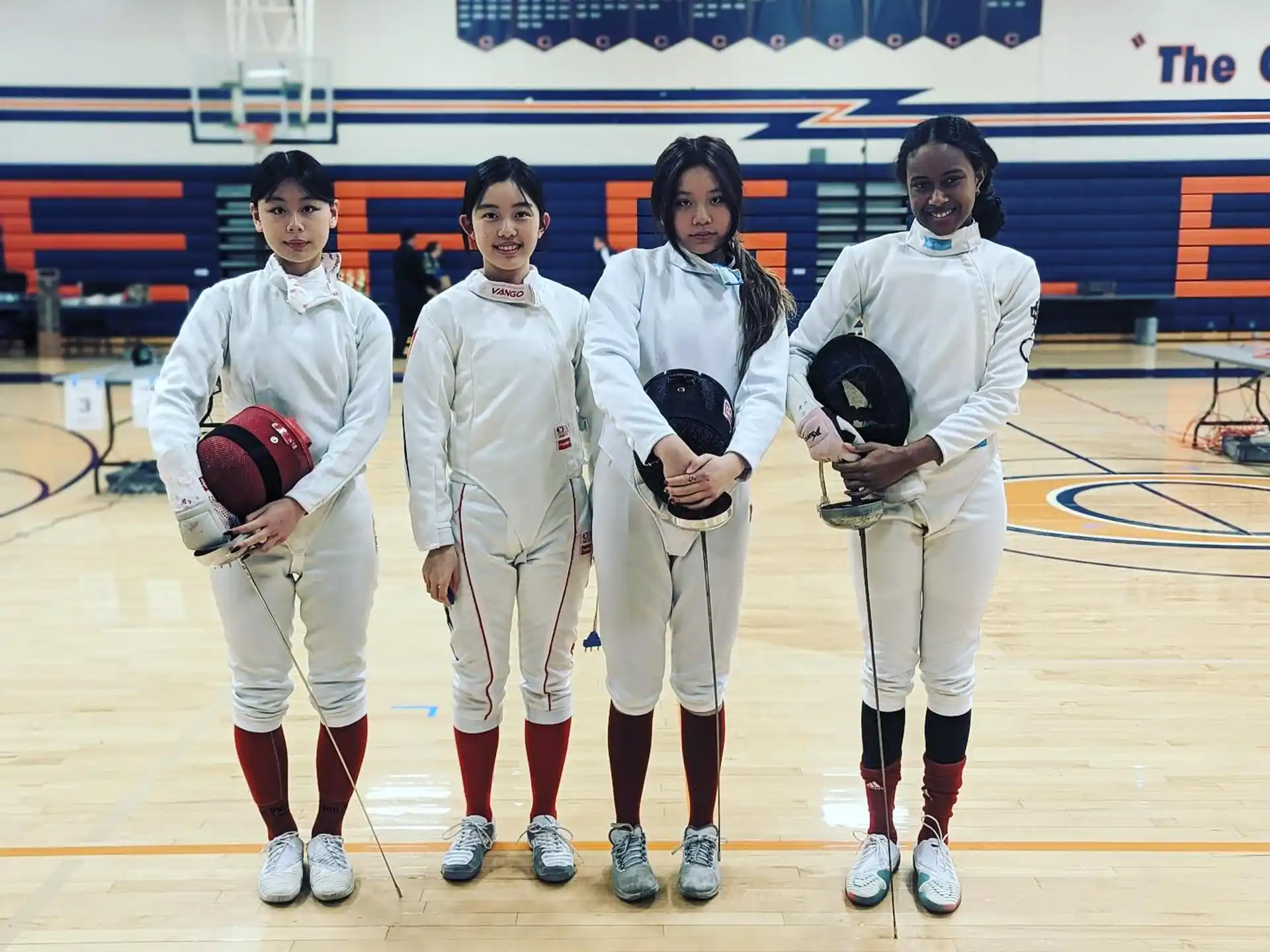 a group of people wearing white uniforms