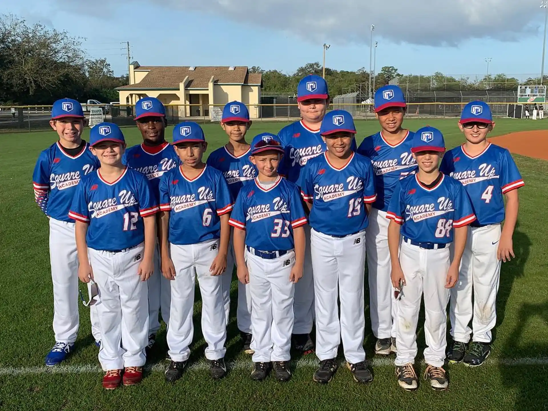 a group of kids wearing blue uniforms