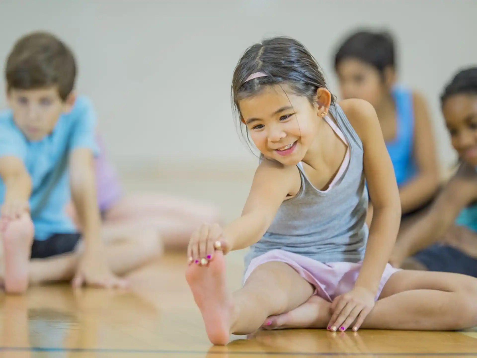 a group of children sitting on the floor