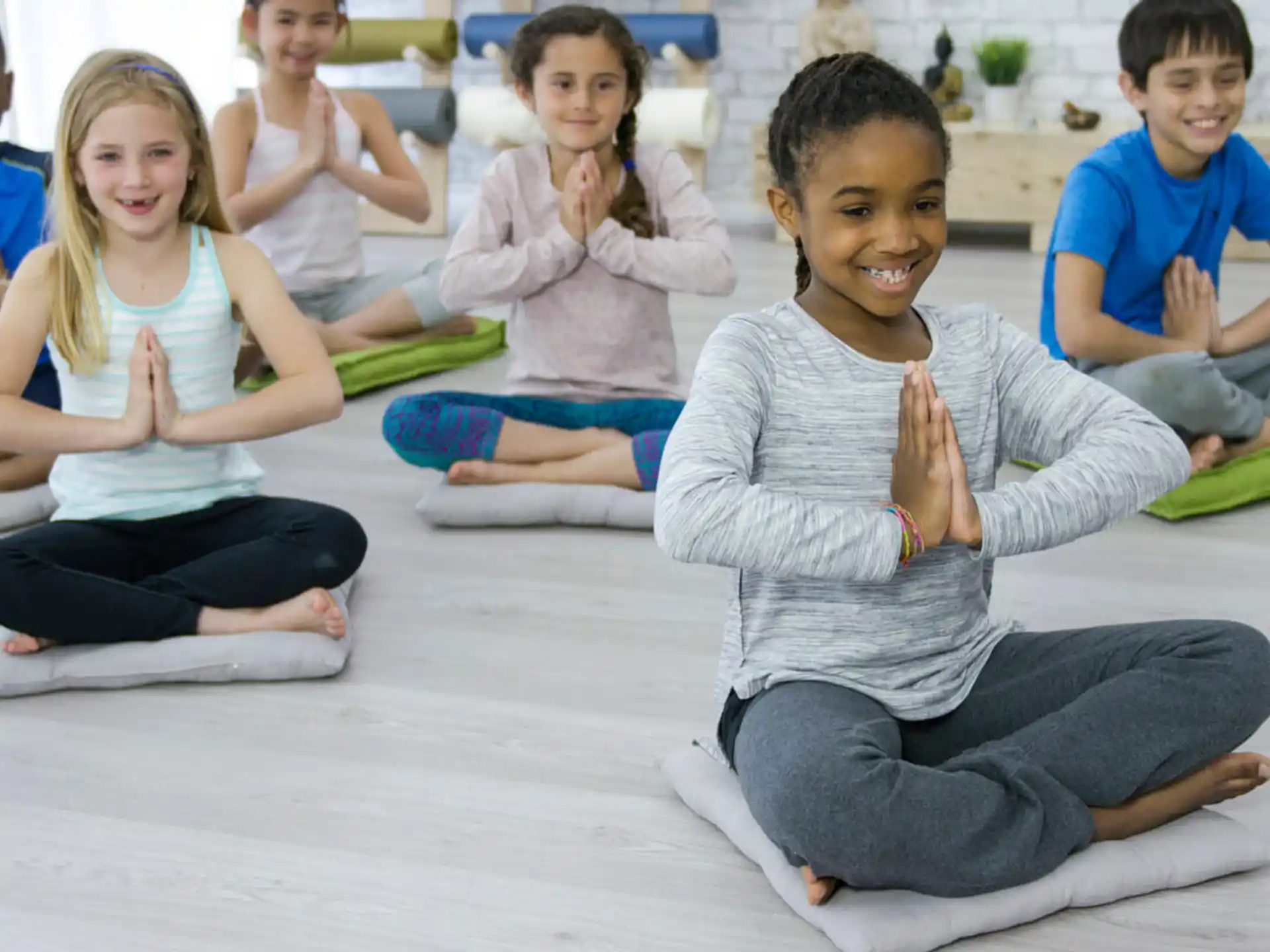 a group of children sitting on the floor