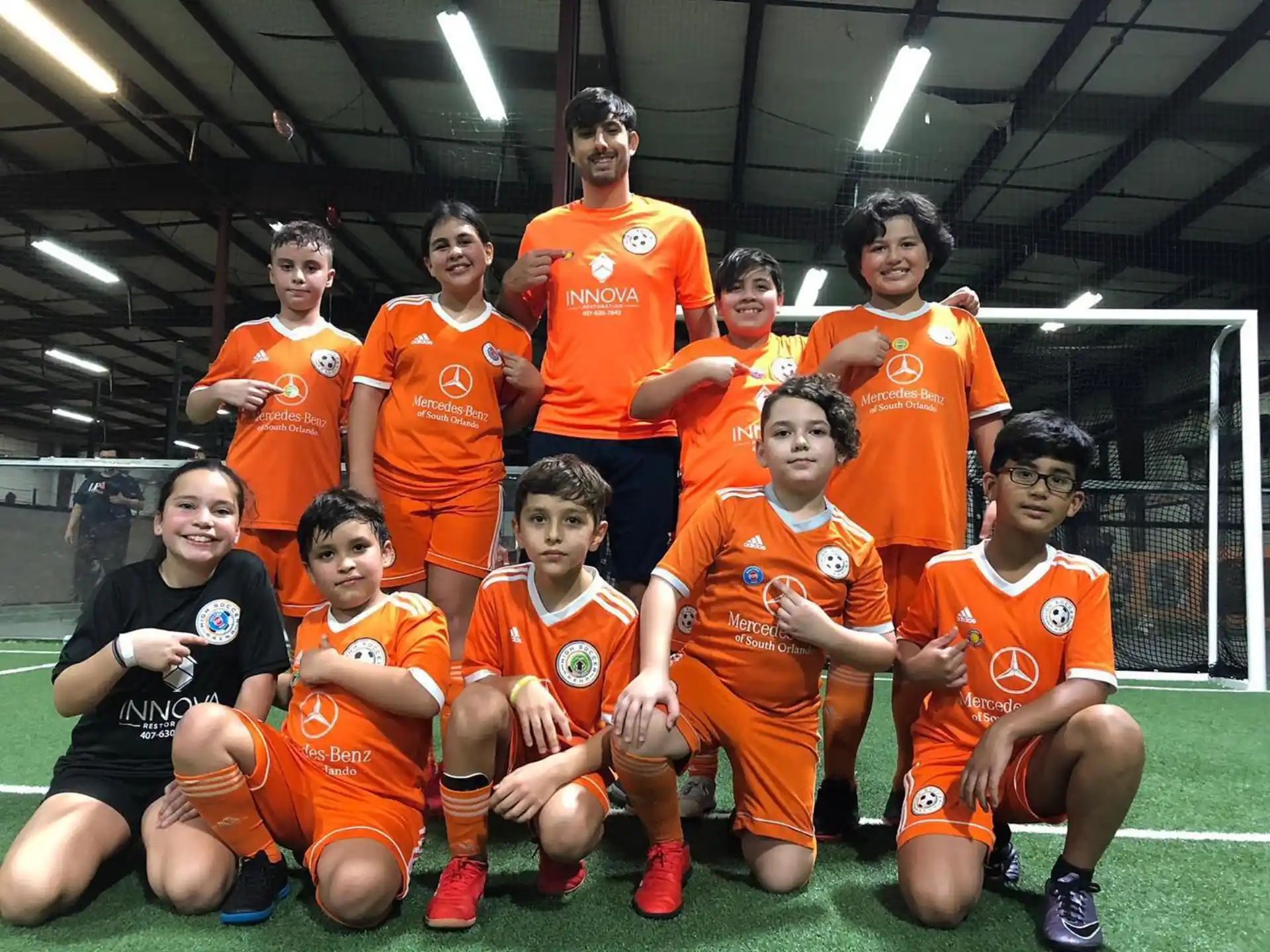 a group of football players posing for a photo