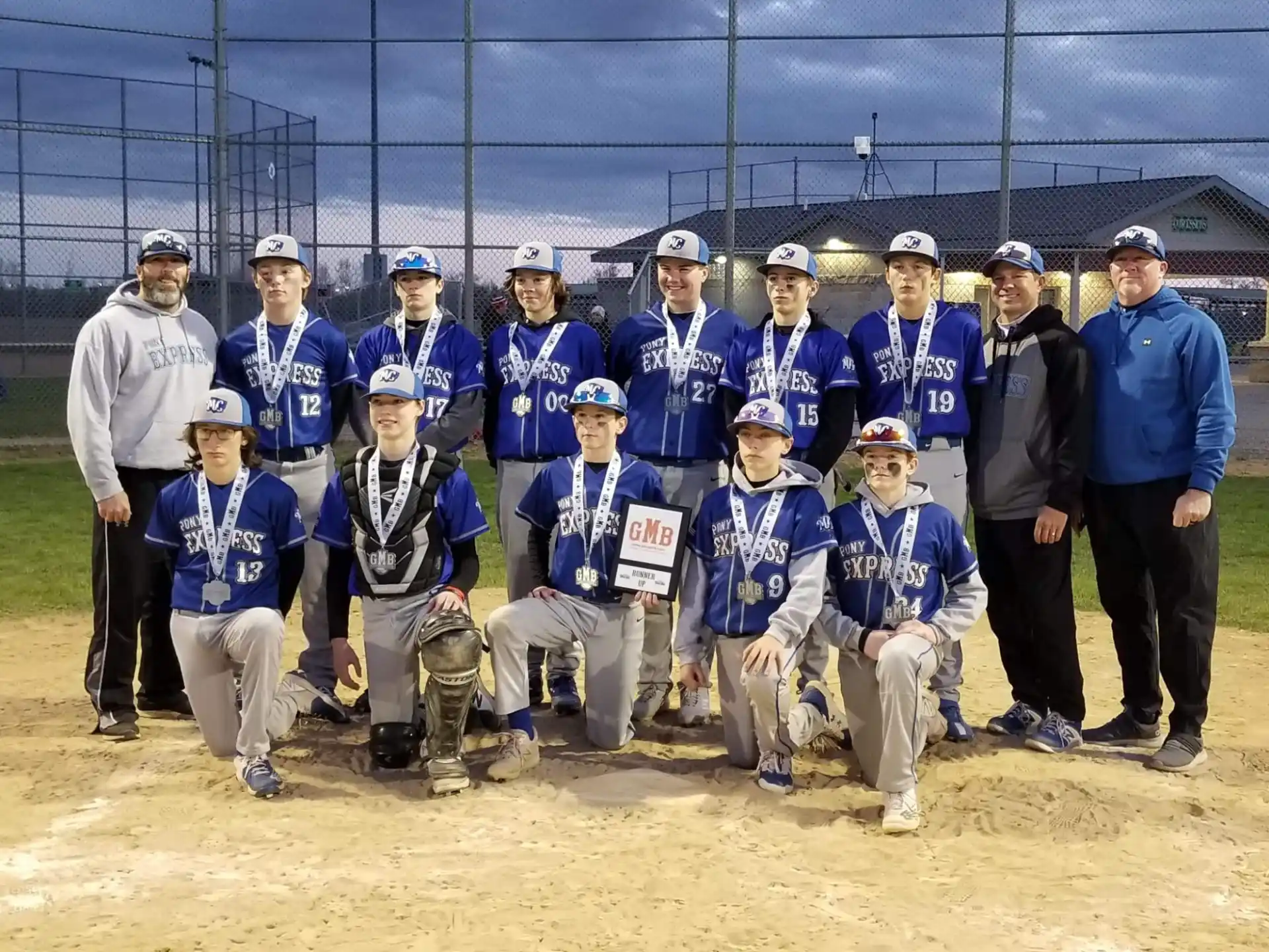 a group of baseball players posing for a photo