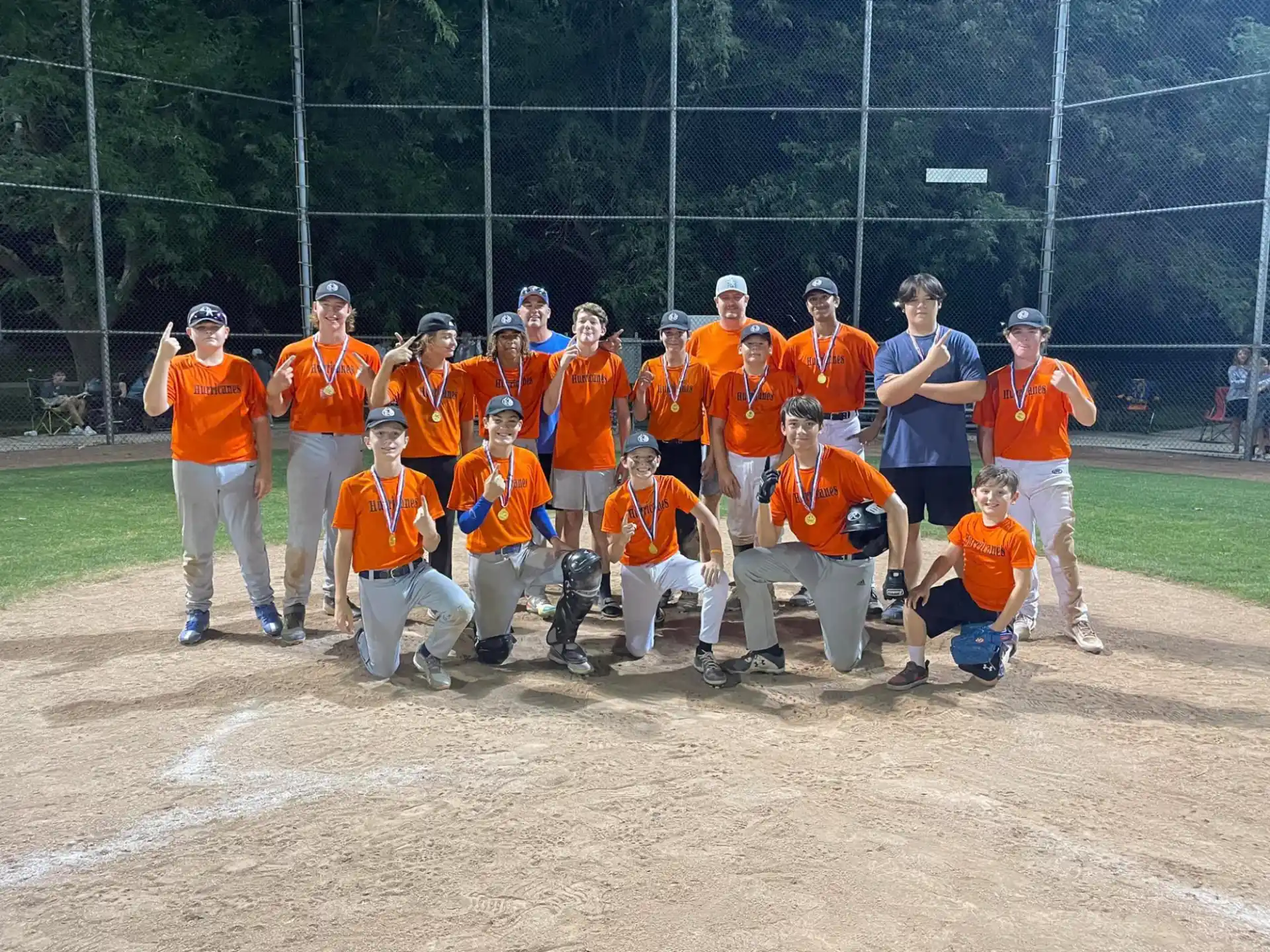 a group of baseball players posing for a photo