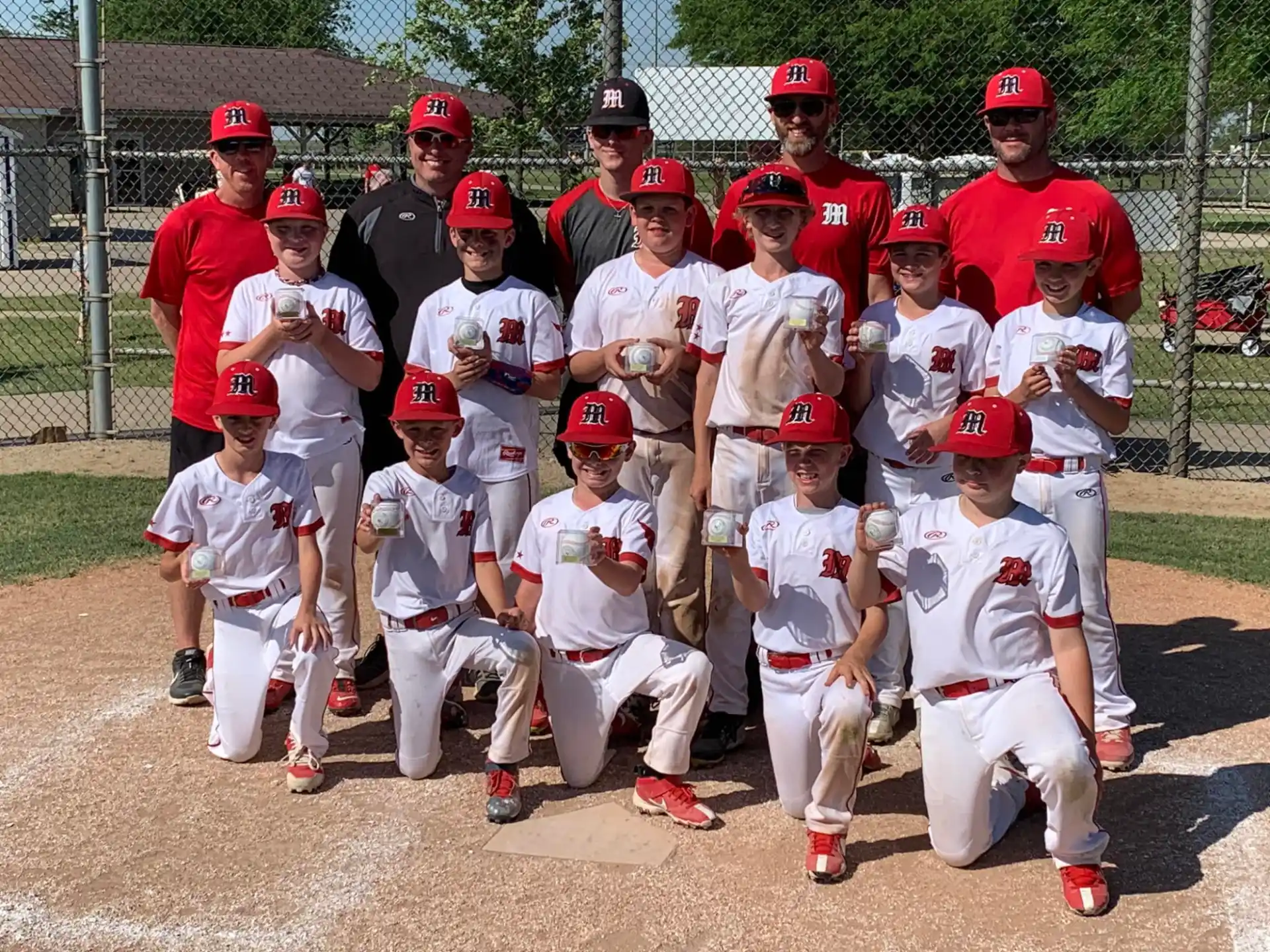 a group of baseball players posing for a photo