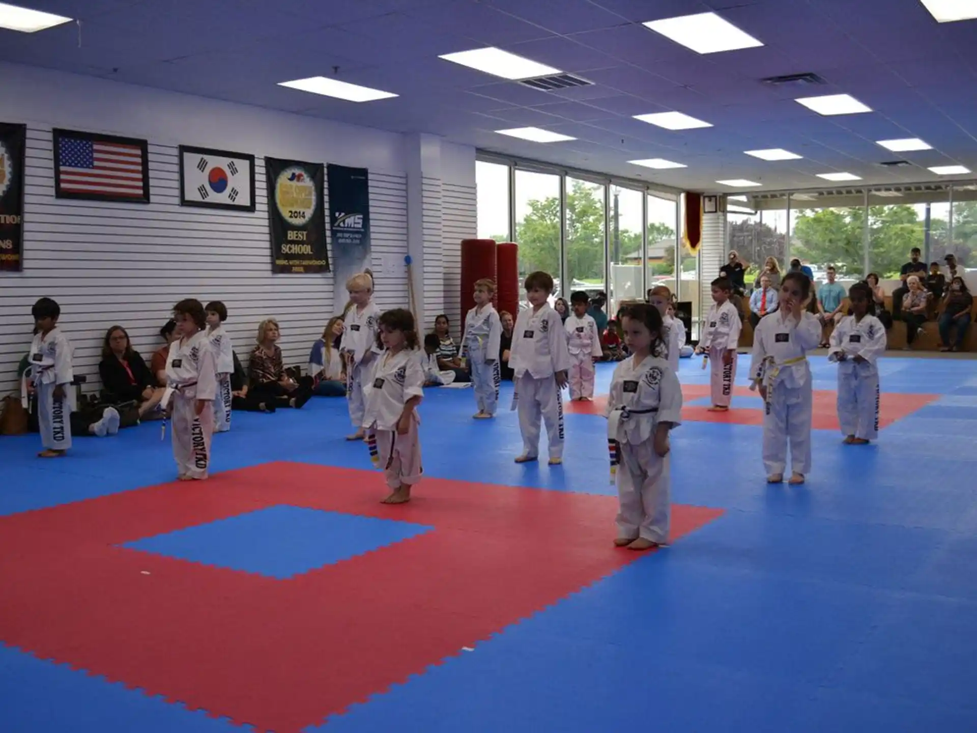 a group of children in karate uniforms