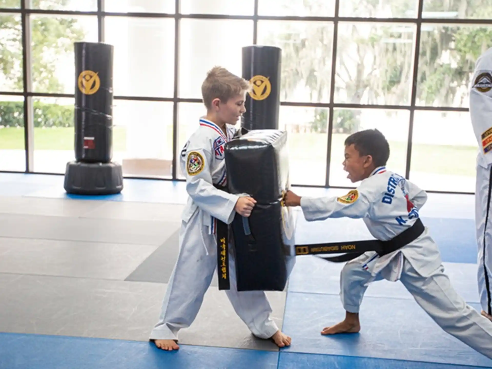a group of men in karate uniforms