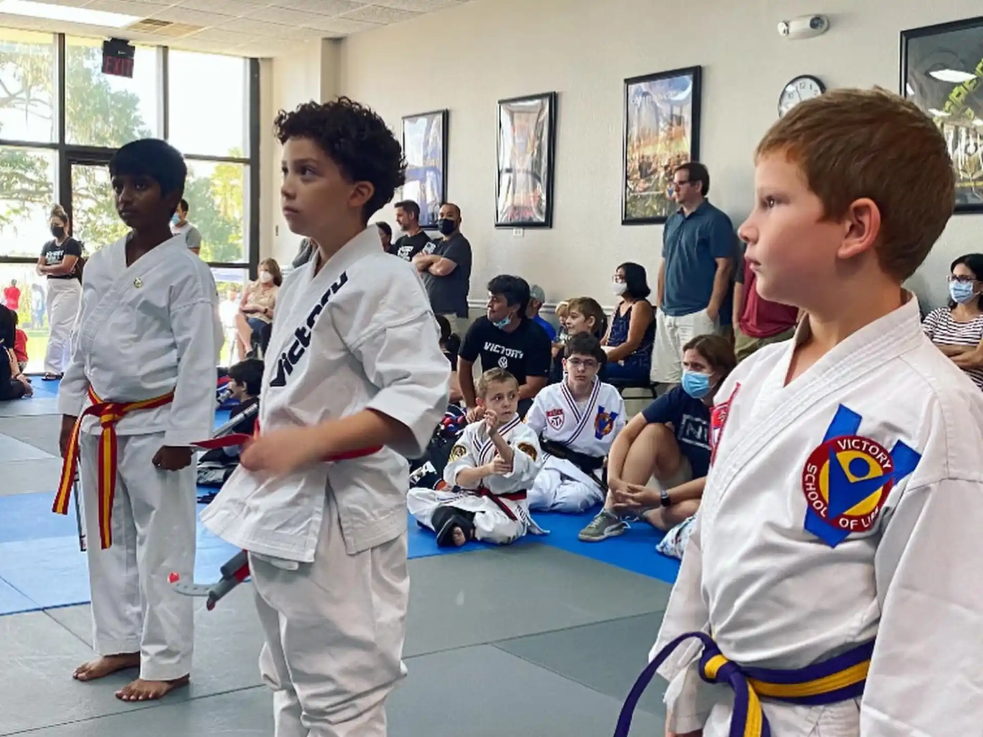 a group of people in karate uniforms
