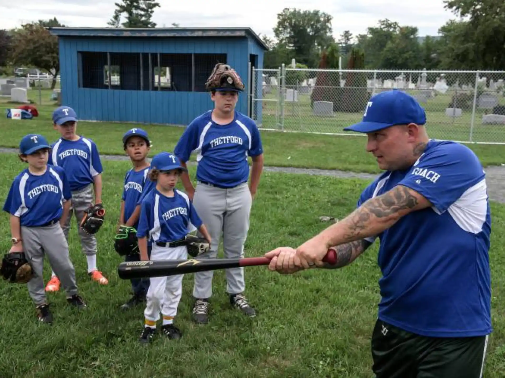 a baseball player prepares to swing a bat