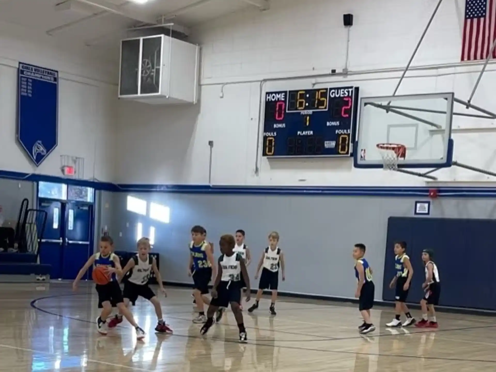 a group of people playing basketball