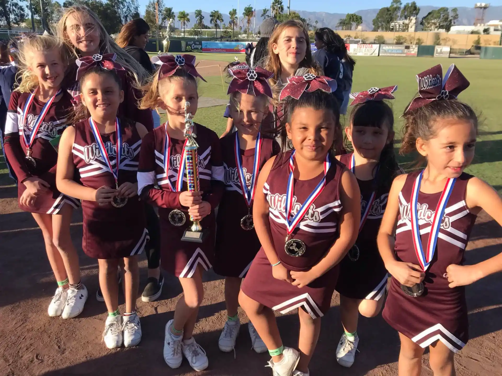 a group of girls wearing medals
