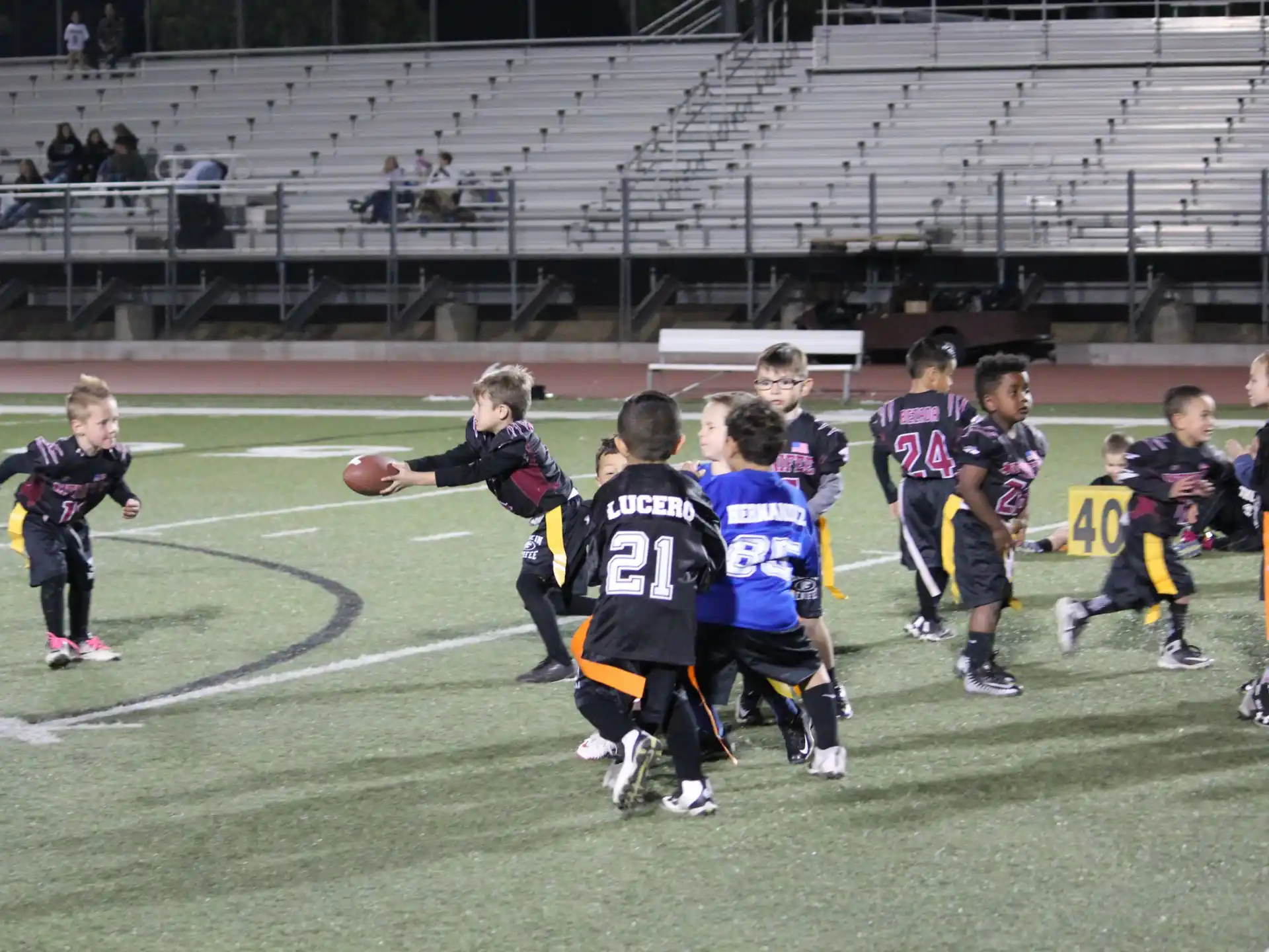 a group of kids playing football