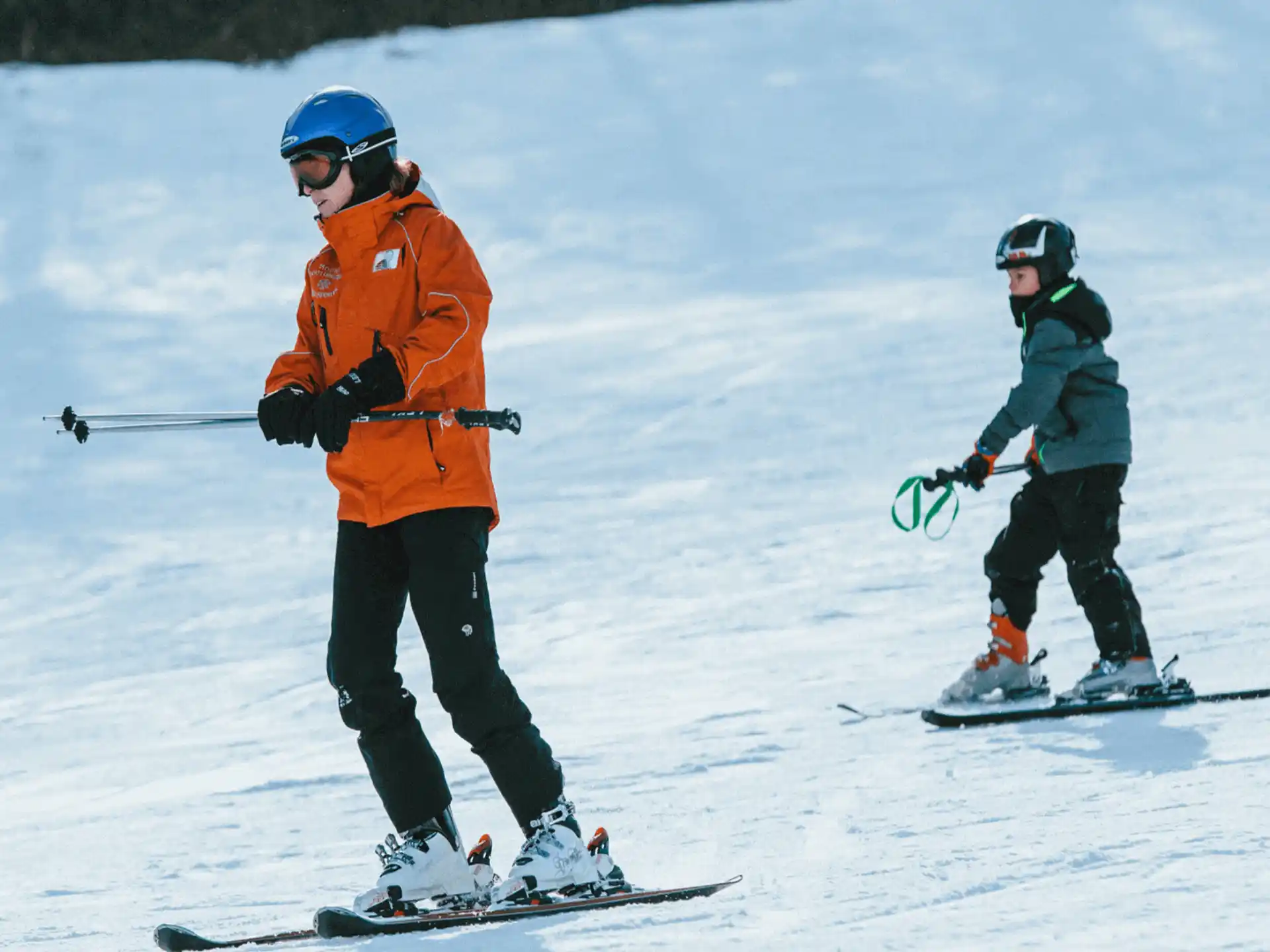 a couple of people skiing