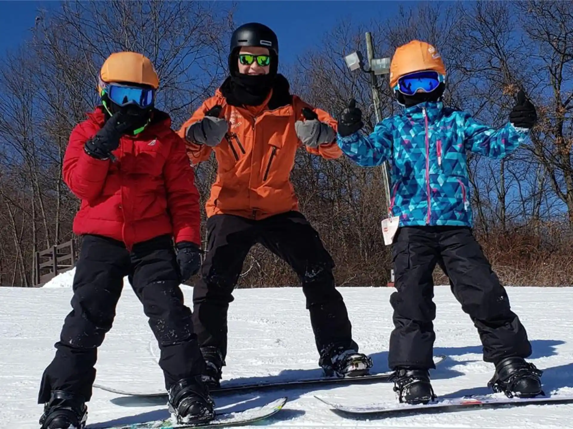 a group of people stand on snow skis