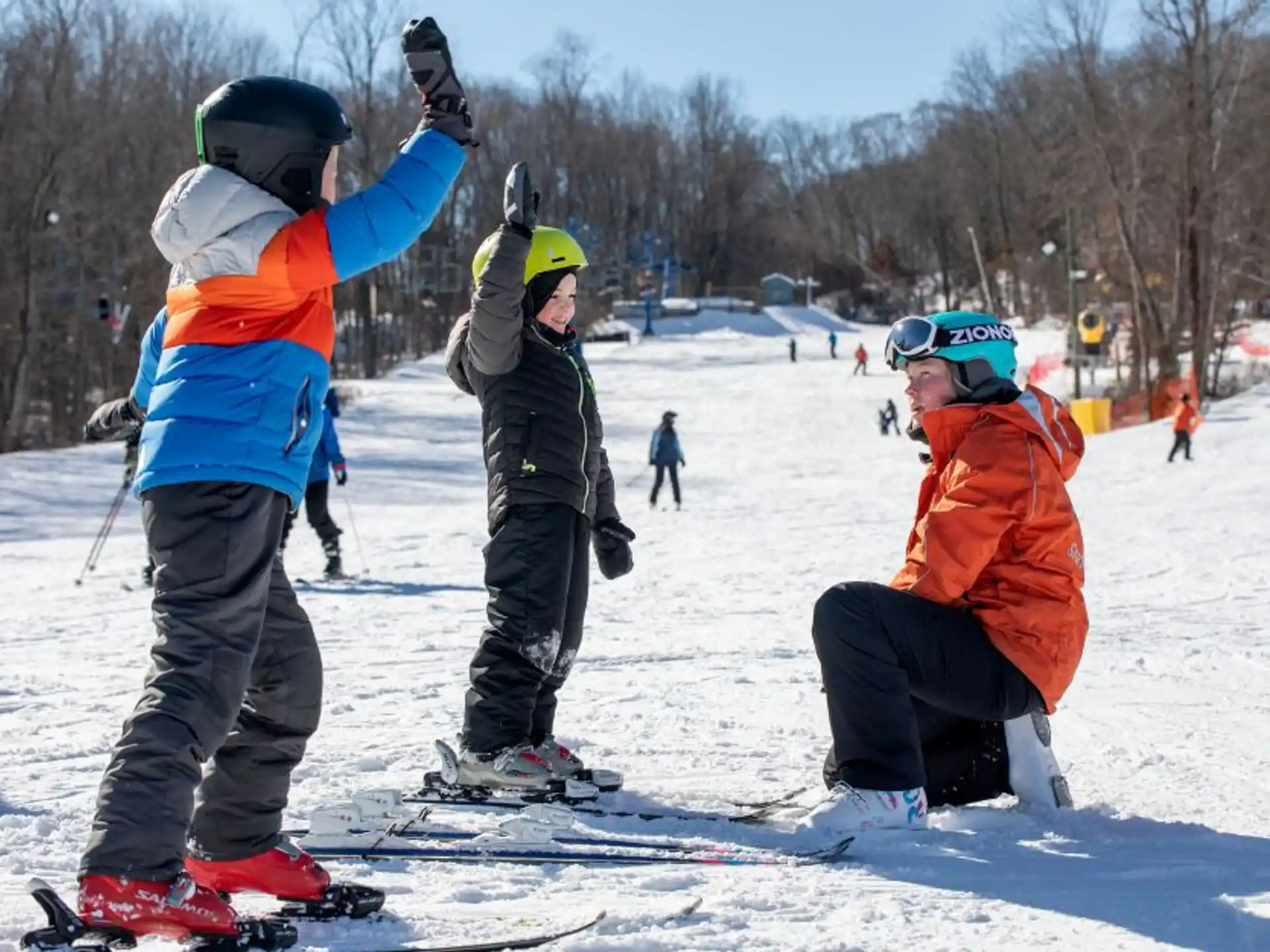 a group of people stand on snow skis