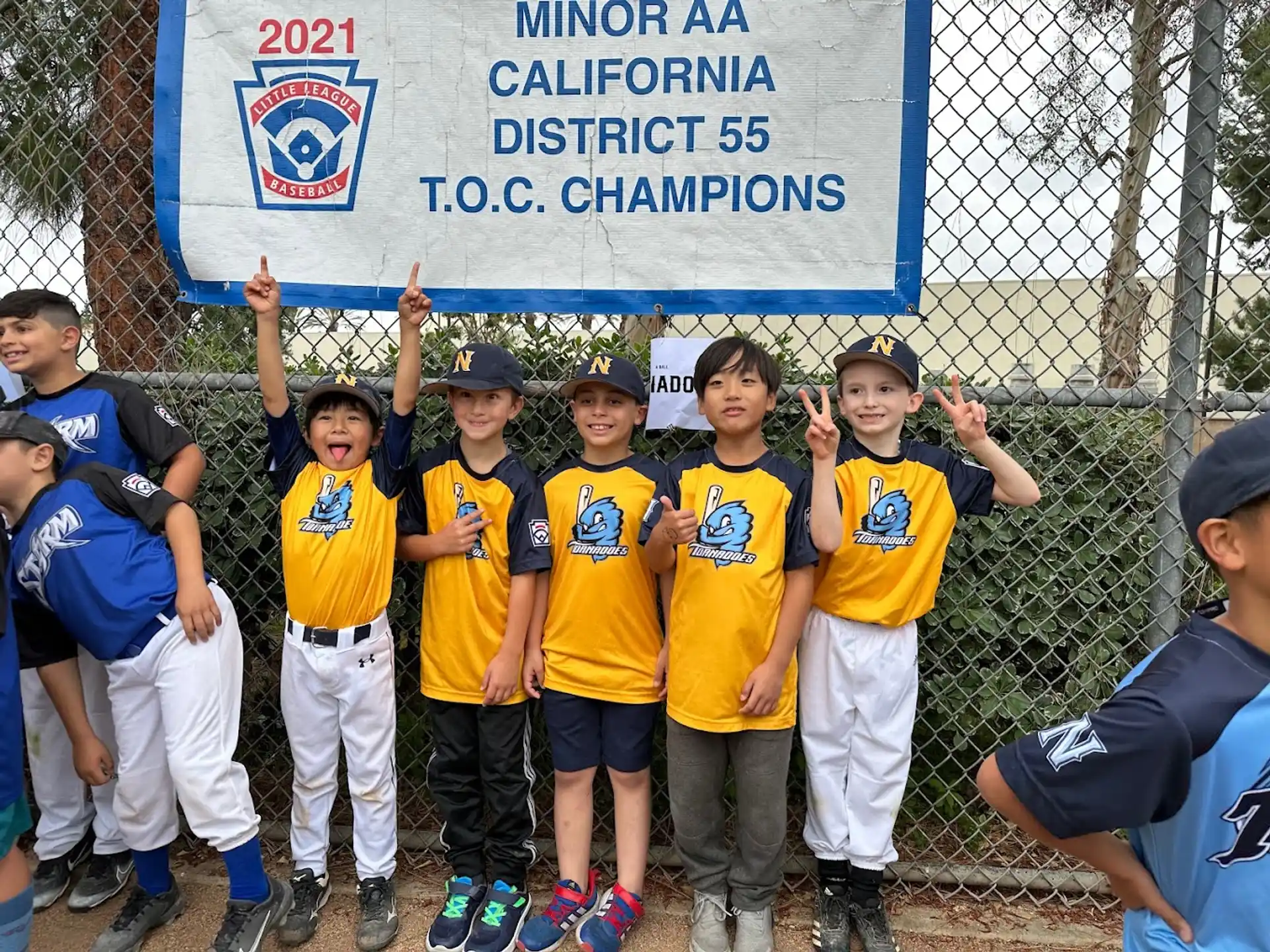 a group of kids in yellow shirts