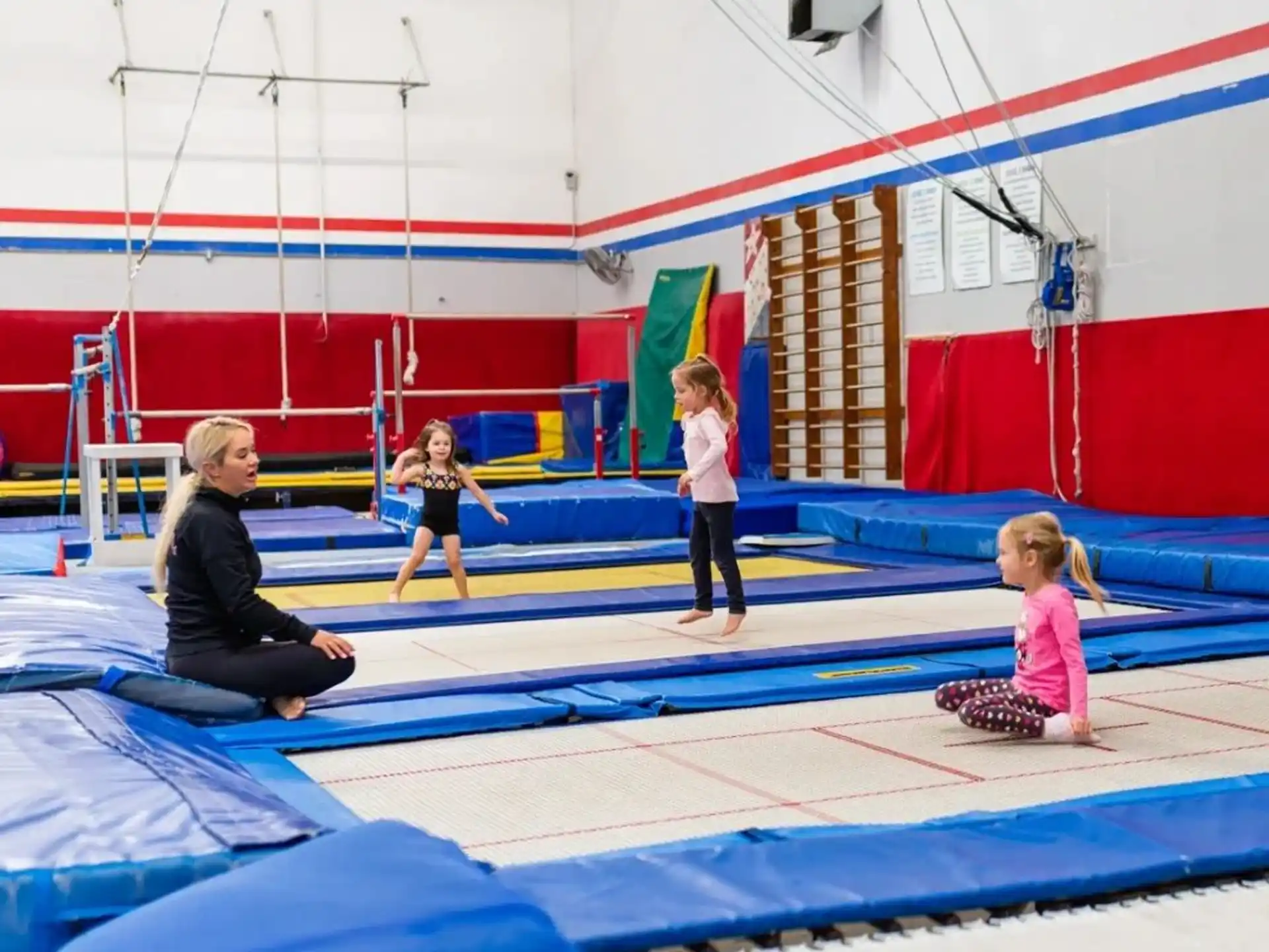 a group of children playing on a trampoline