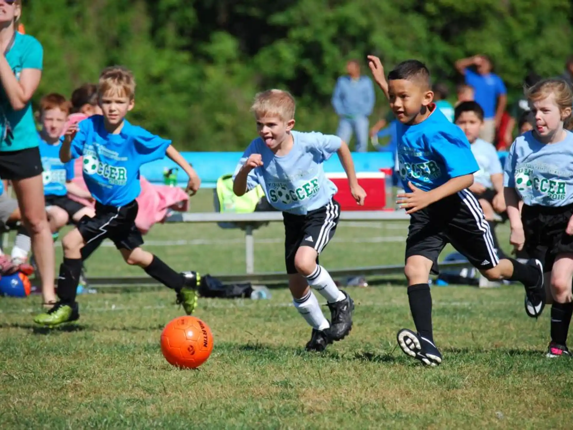 kids playing football on a field