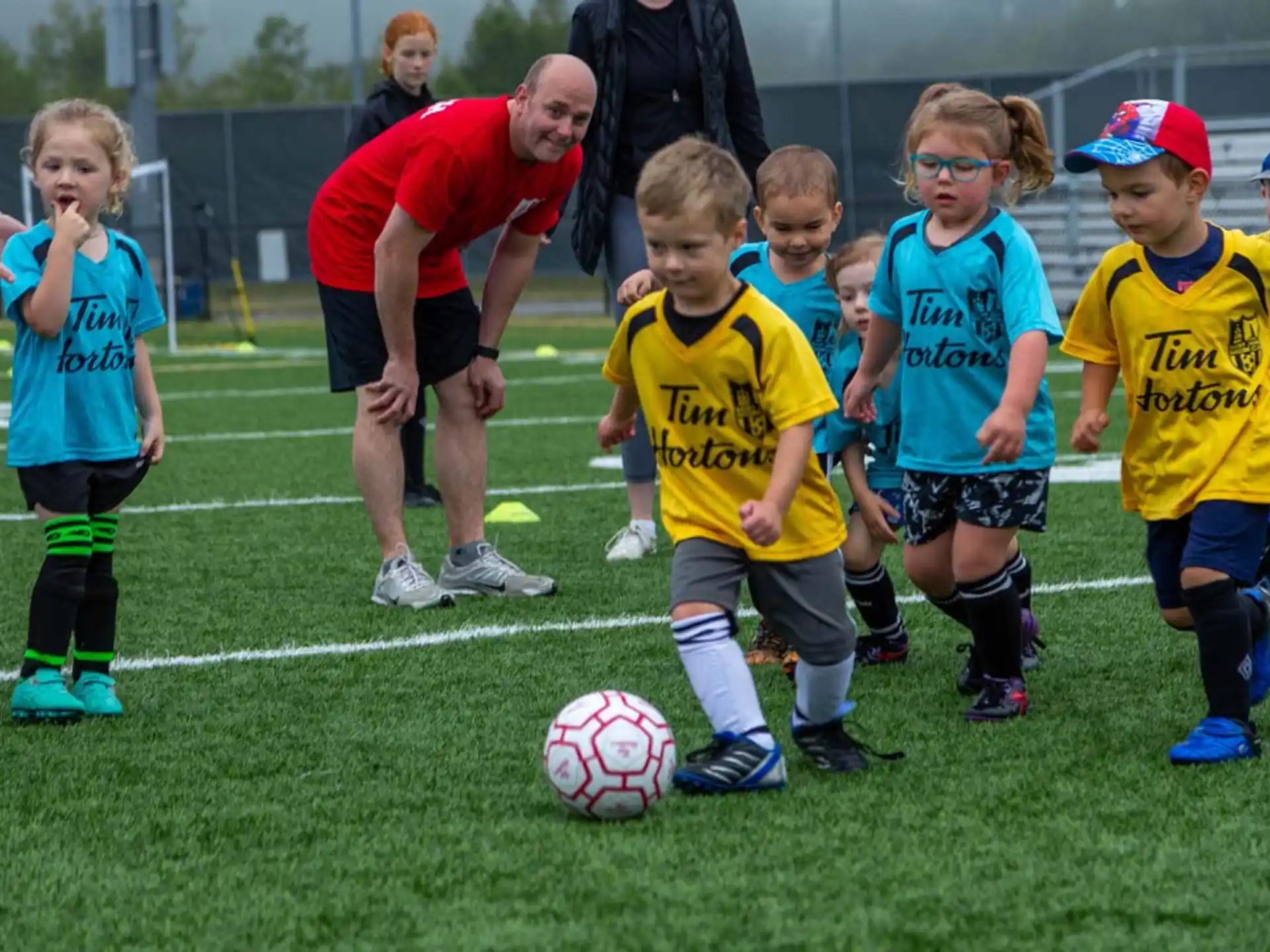 kids playing football on a field