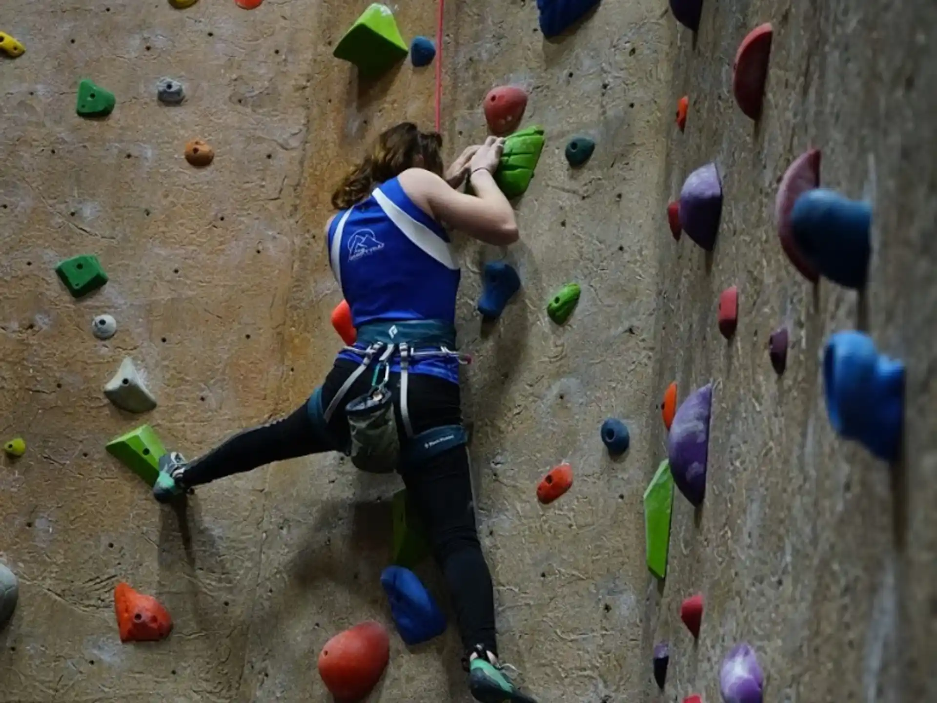 a person climbing a rock wall