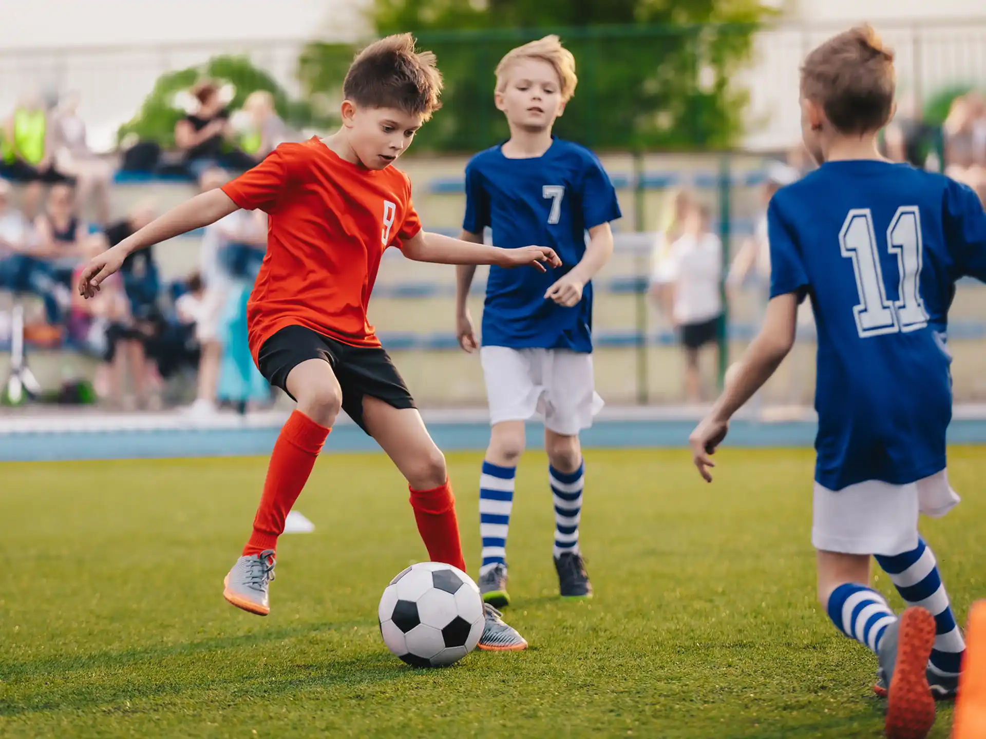 kids playing football on a field