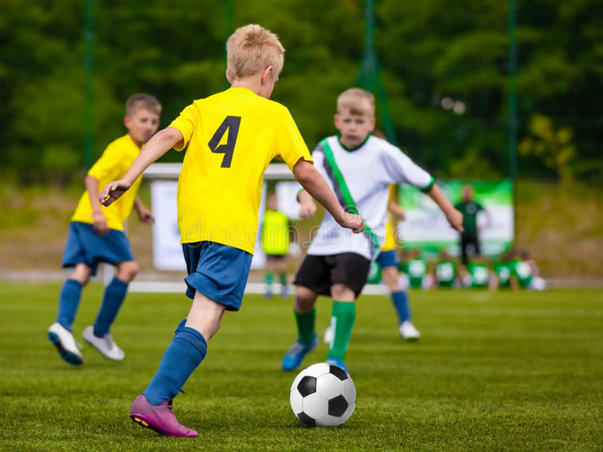 a group of boys playing football