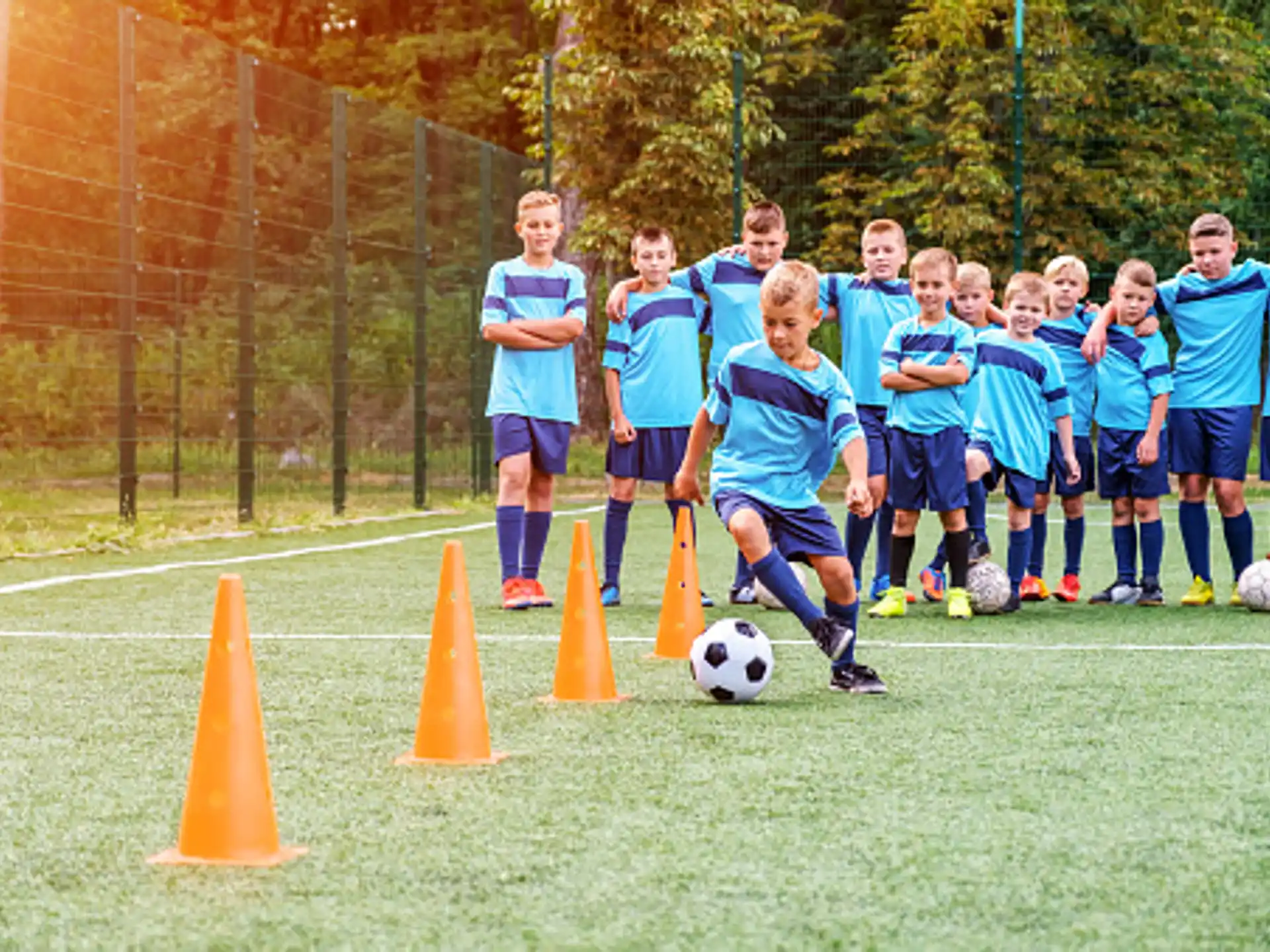 a group of kids playing football