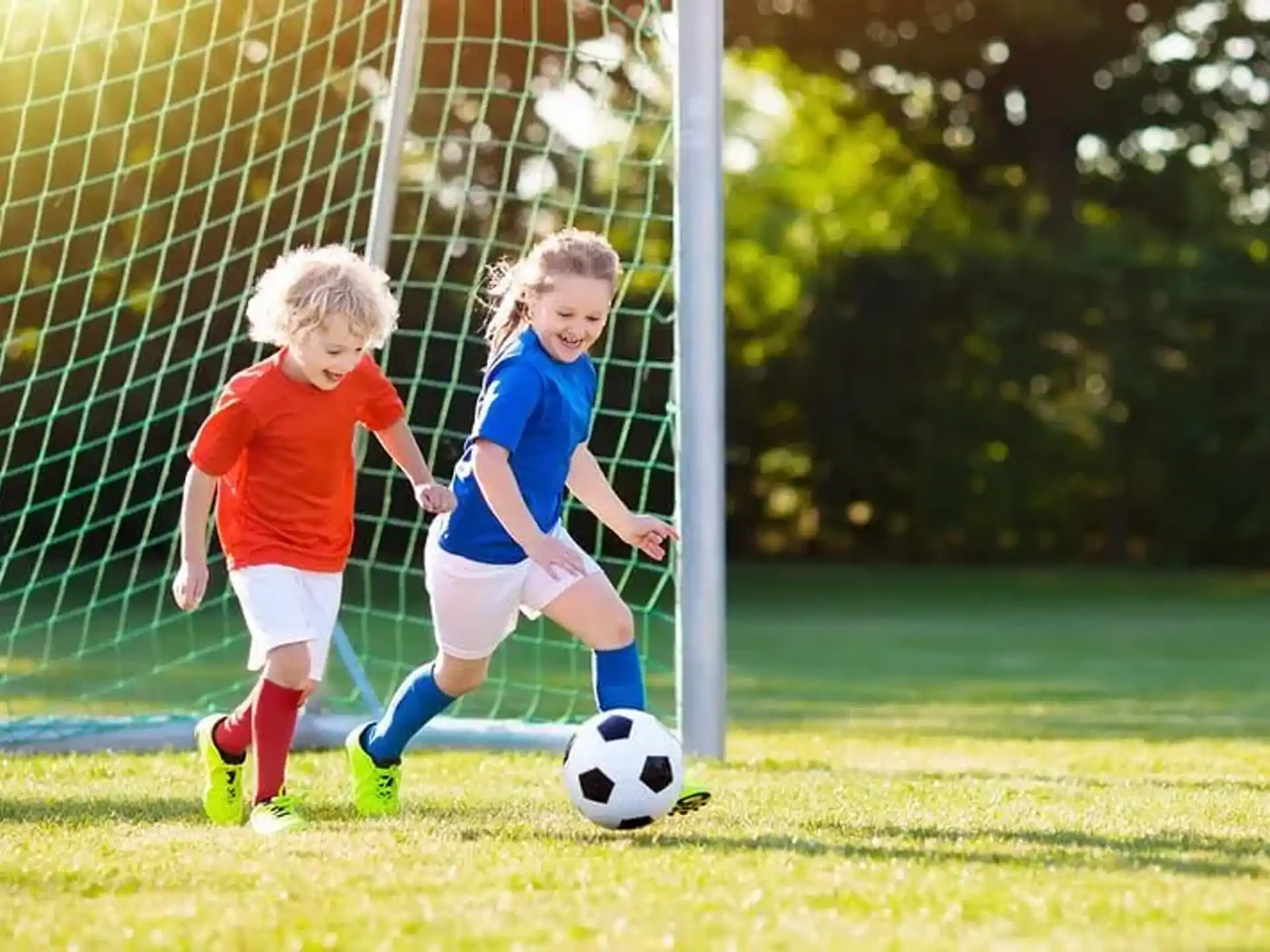 kids playing football on a field