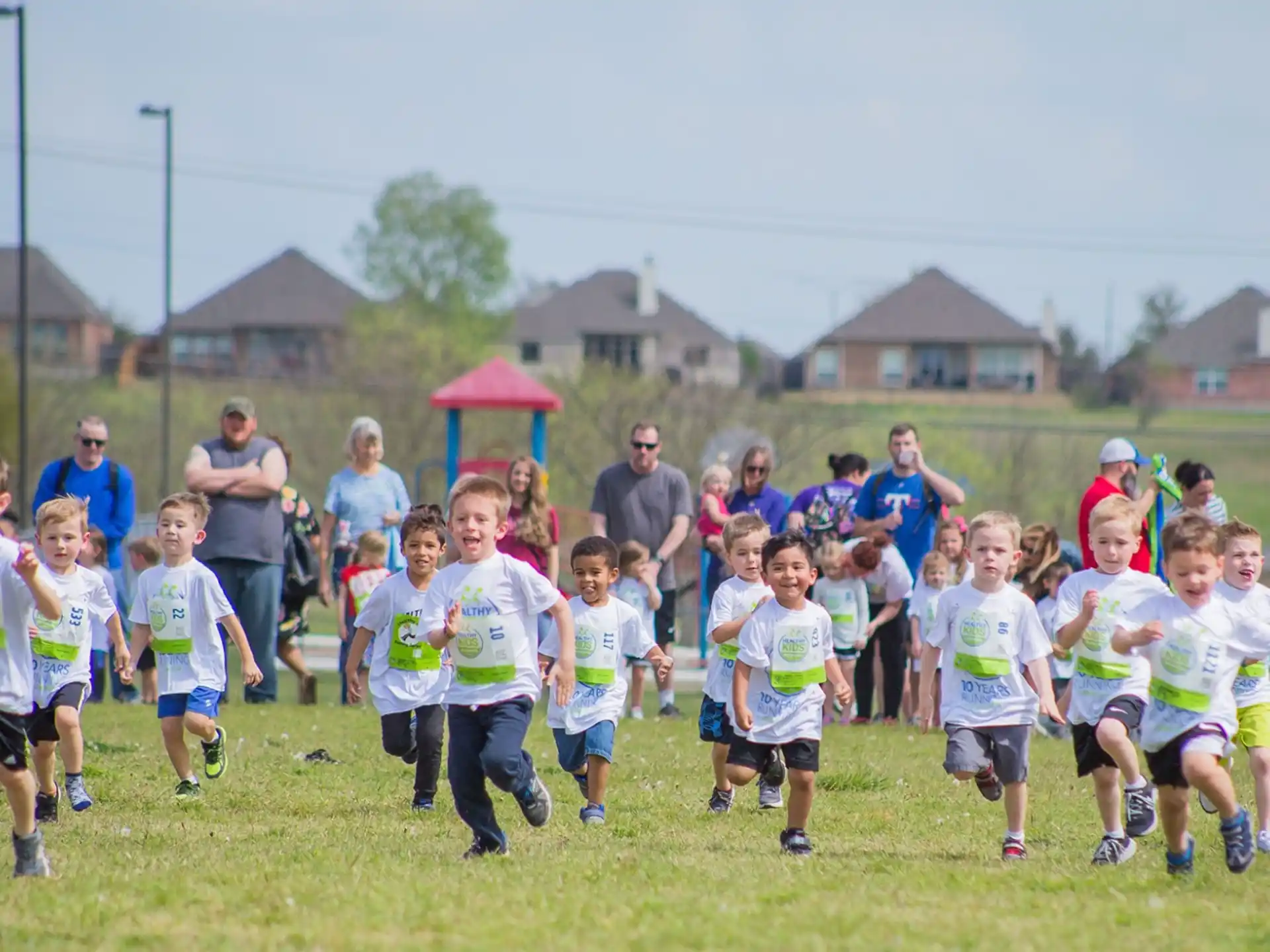 a group of people running on a field