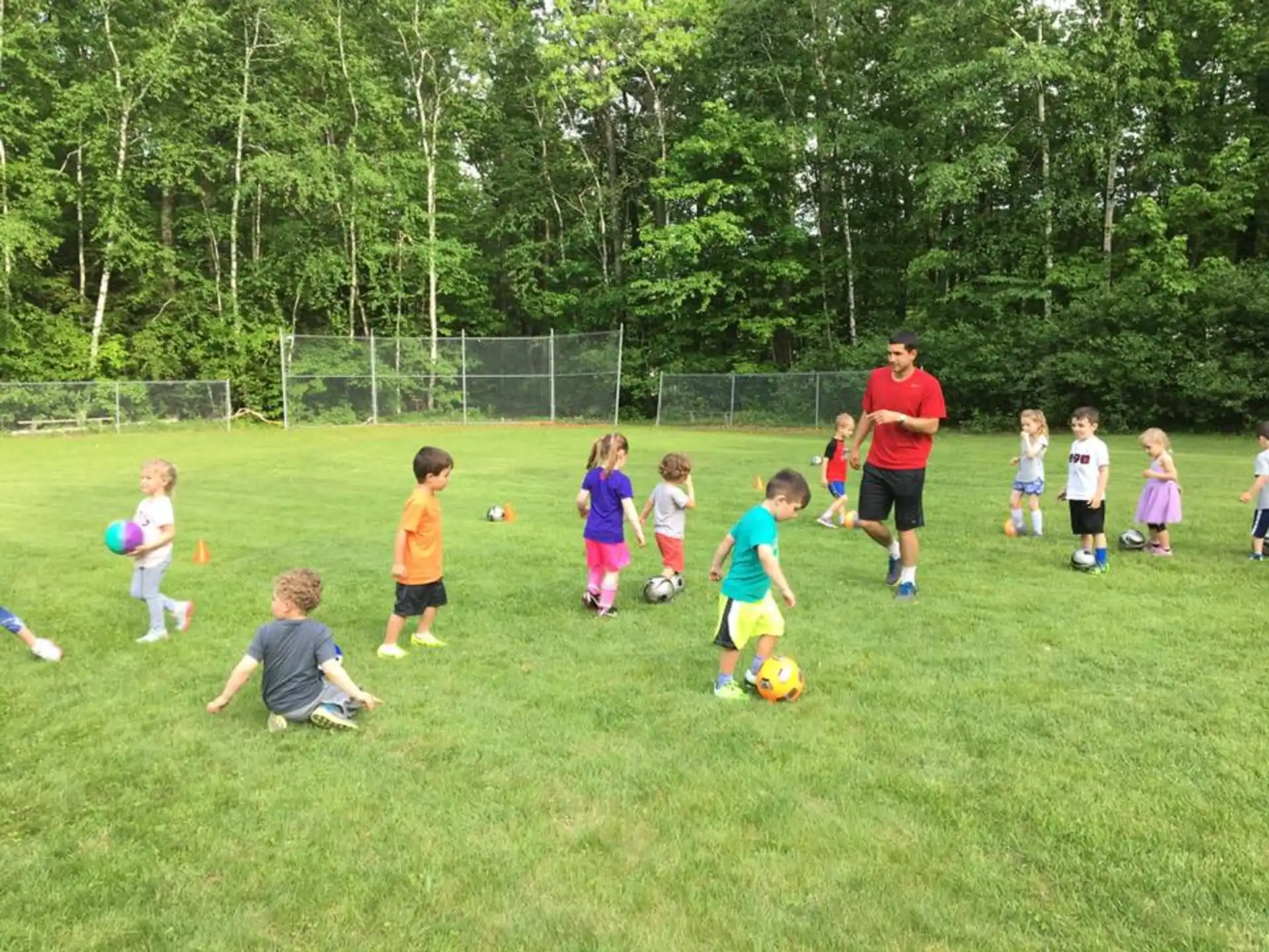 a group of kids playing football