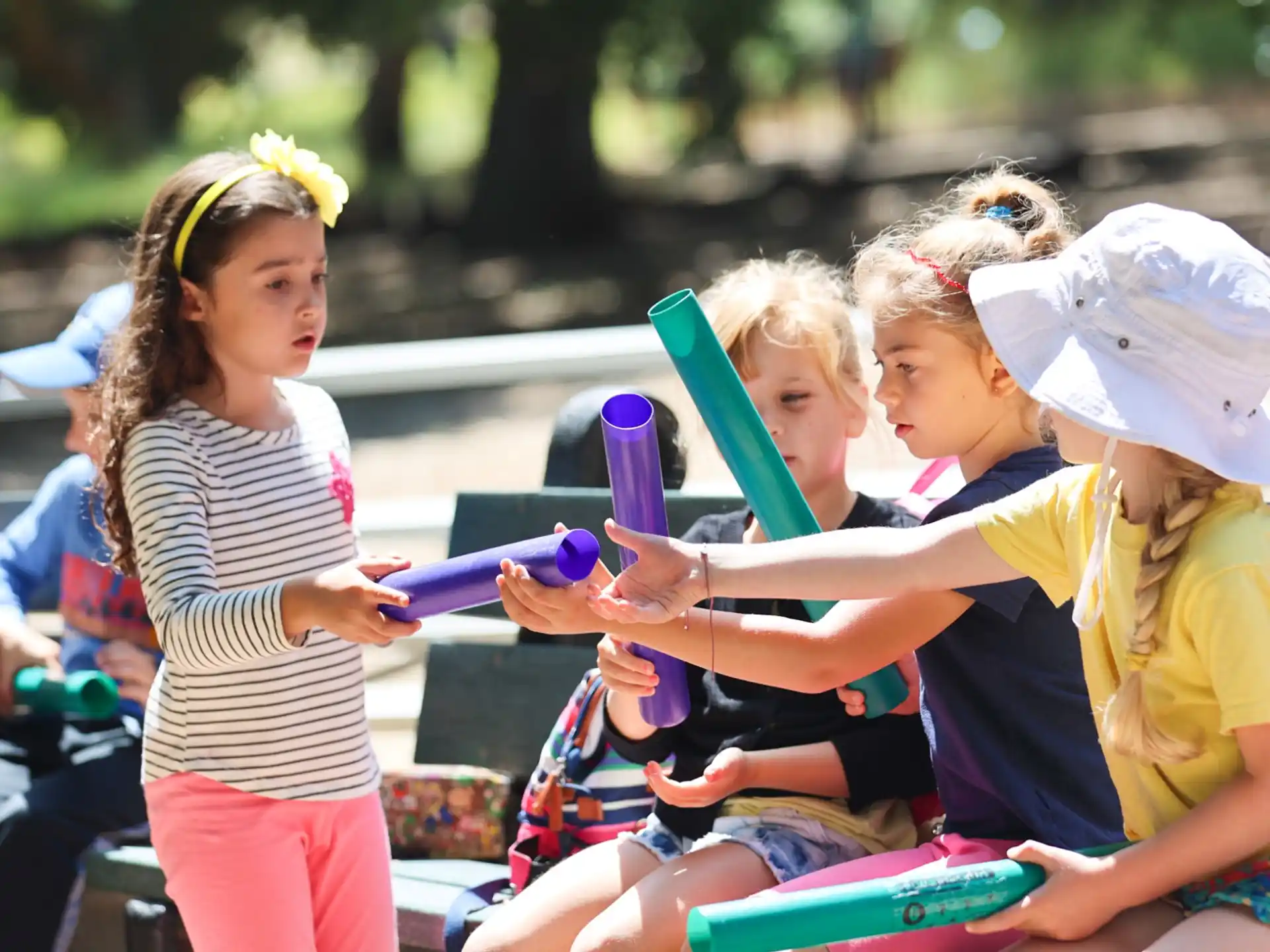a group of children playing with a toy