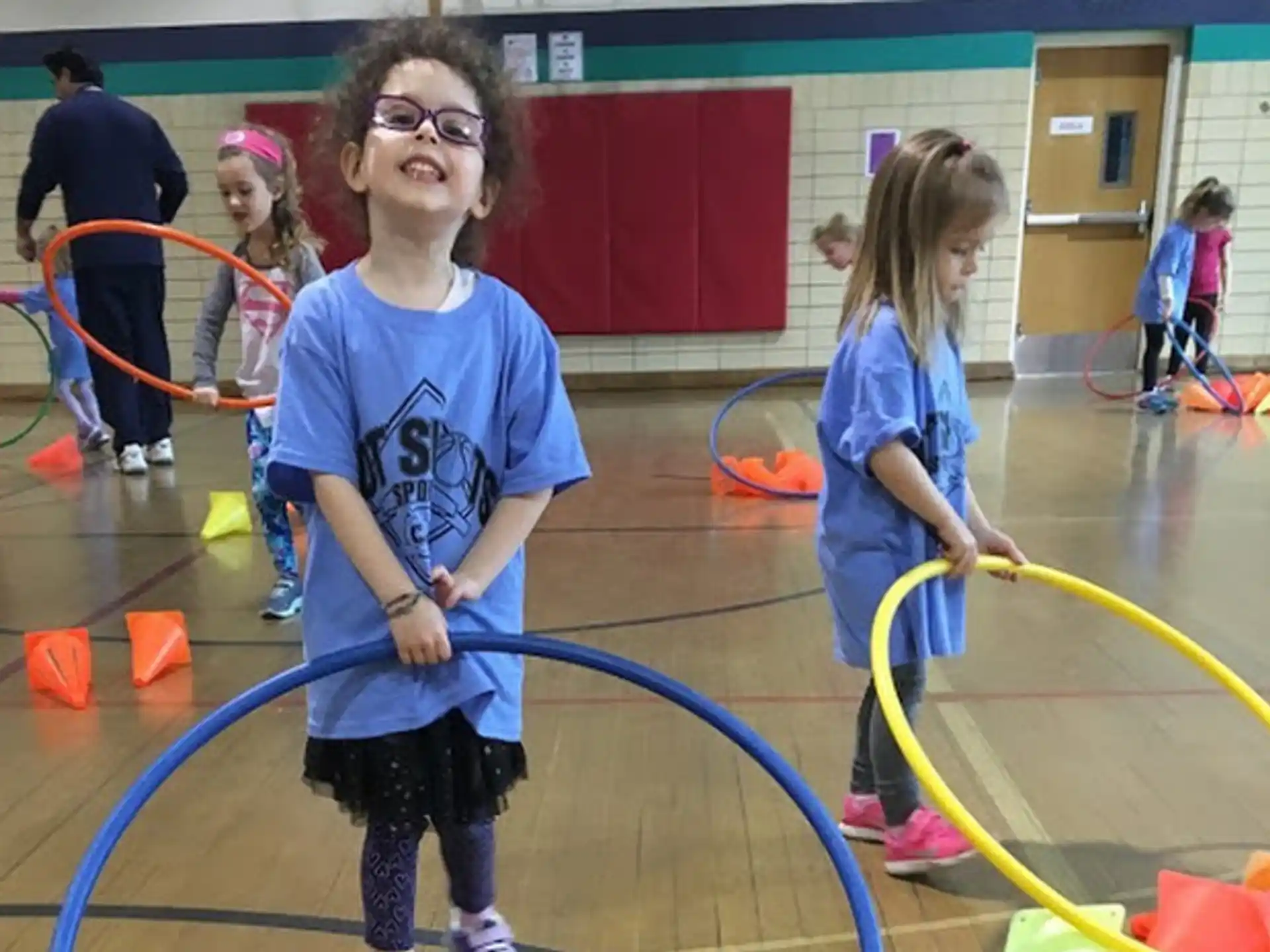 a group of children playing with hoops