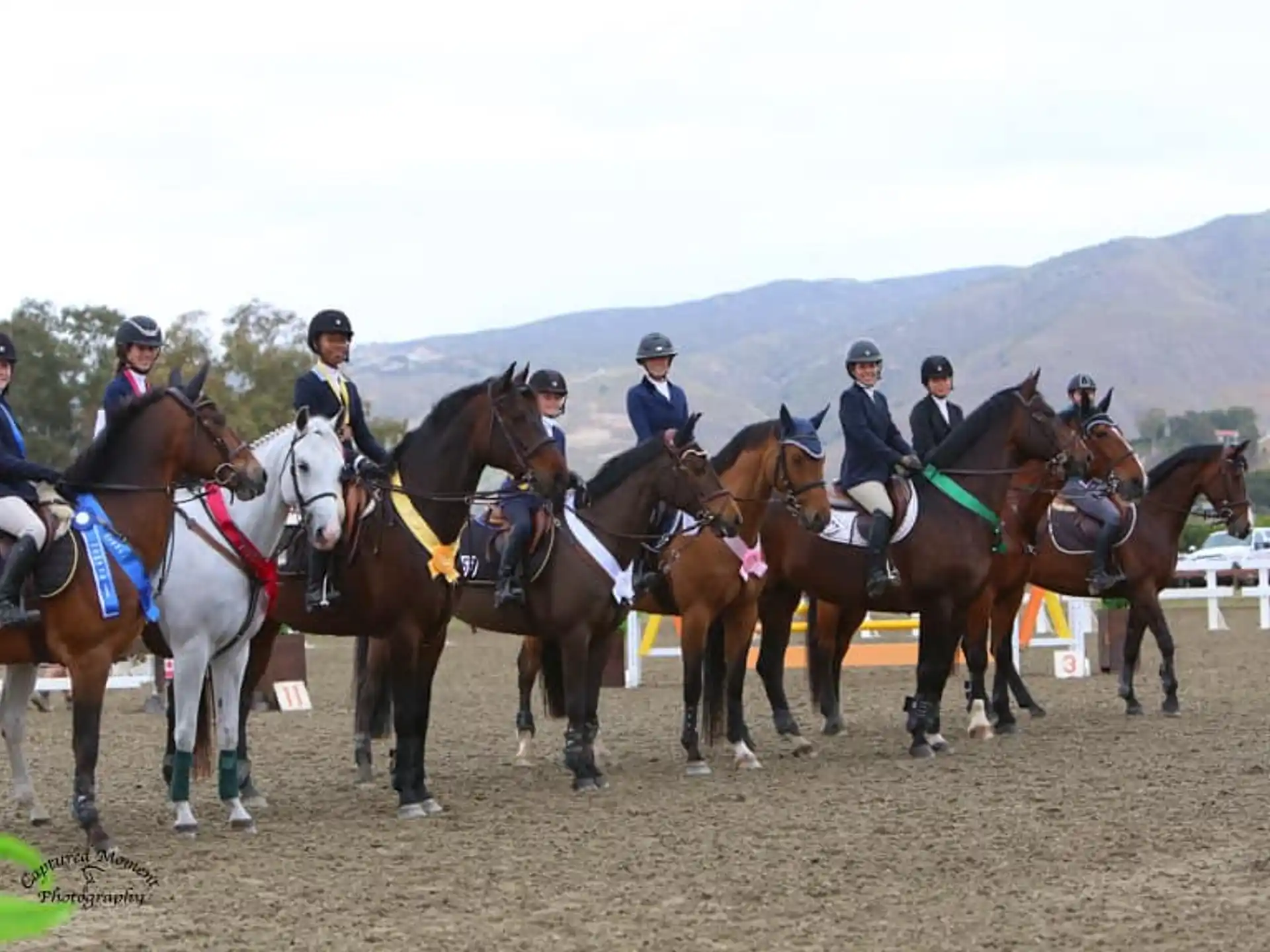 a group of people riding horses