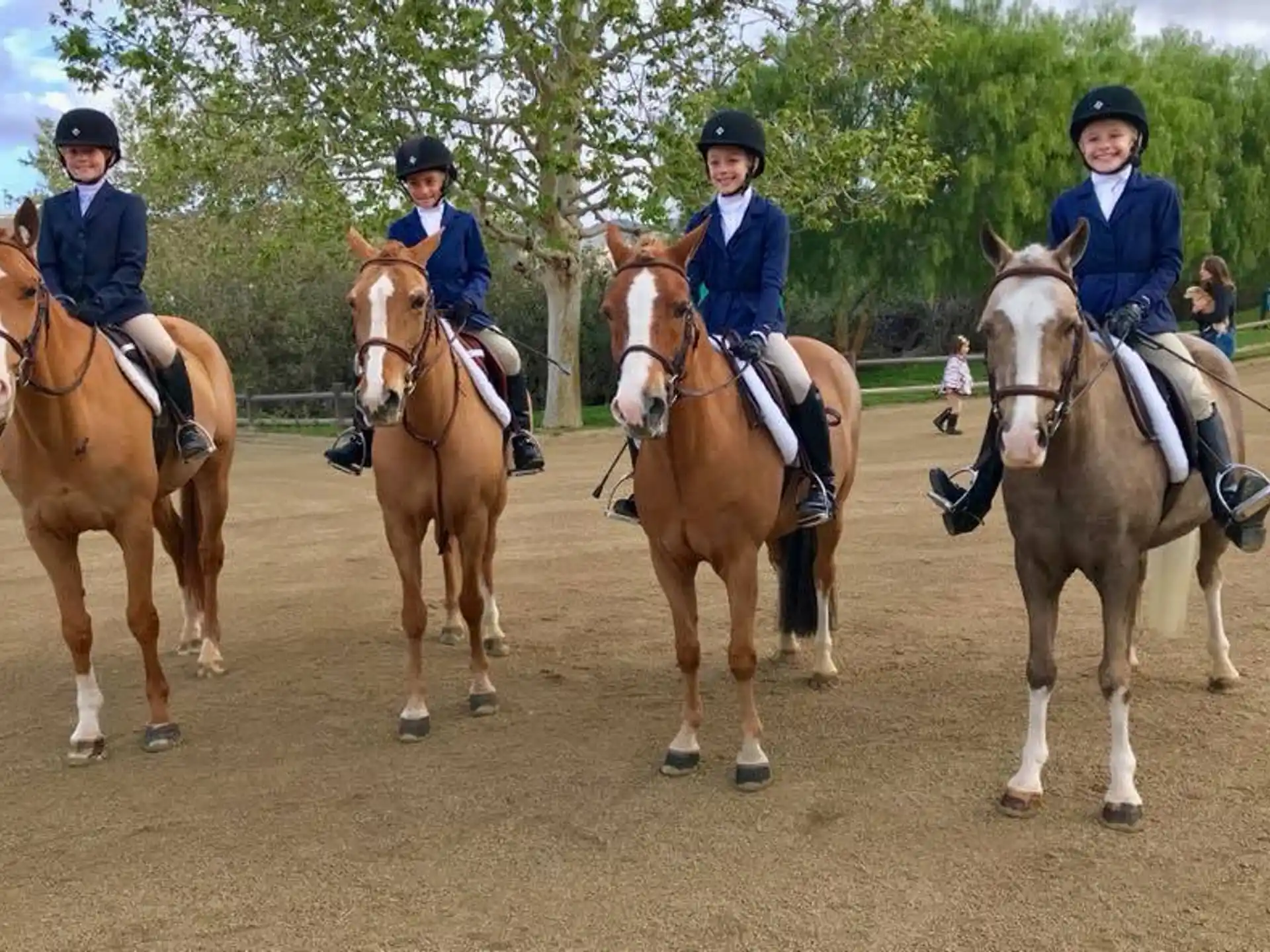 a group of people riding horses
