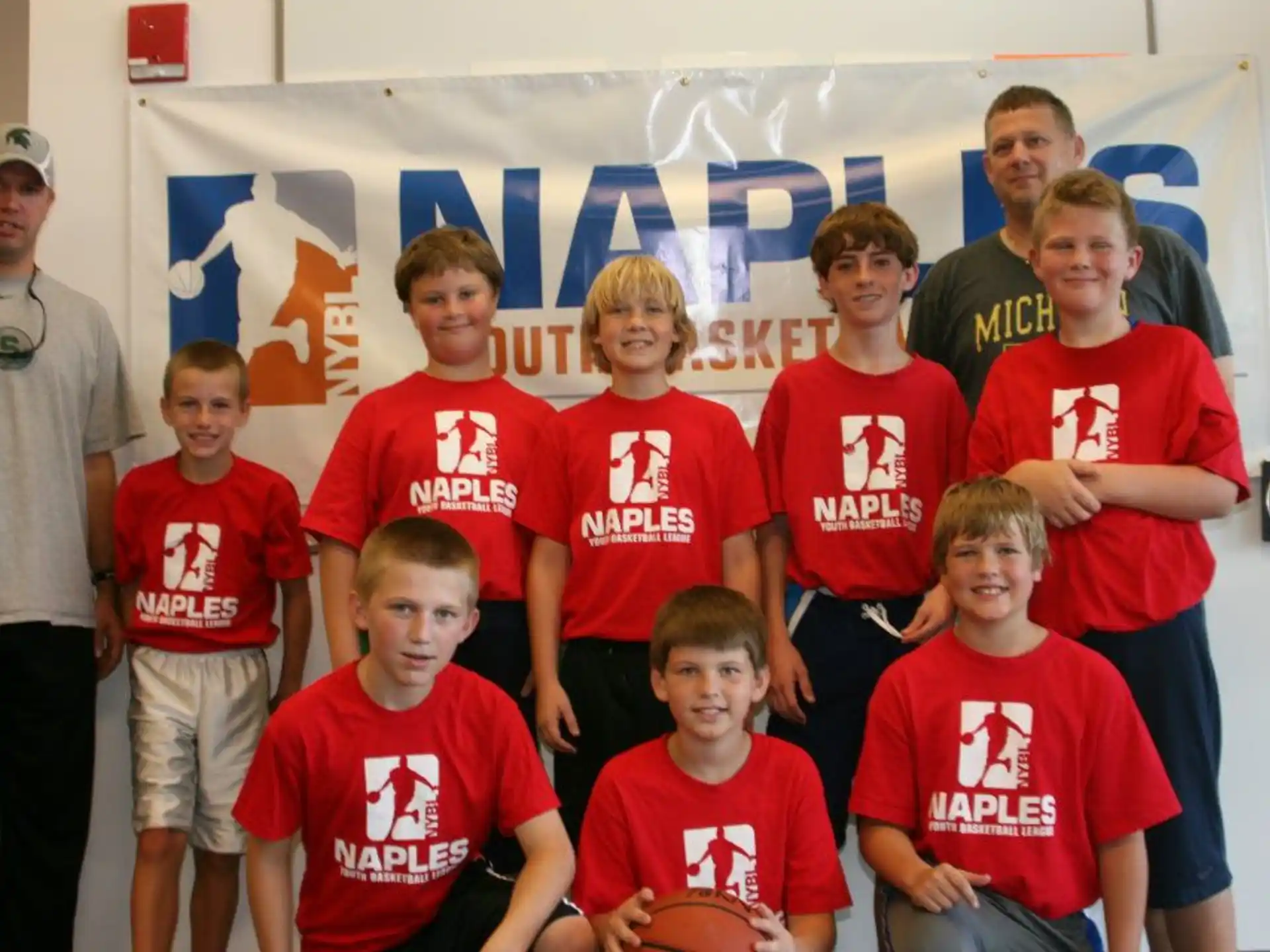 a group of people wearing red shirts