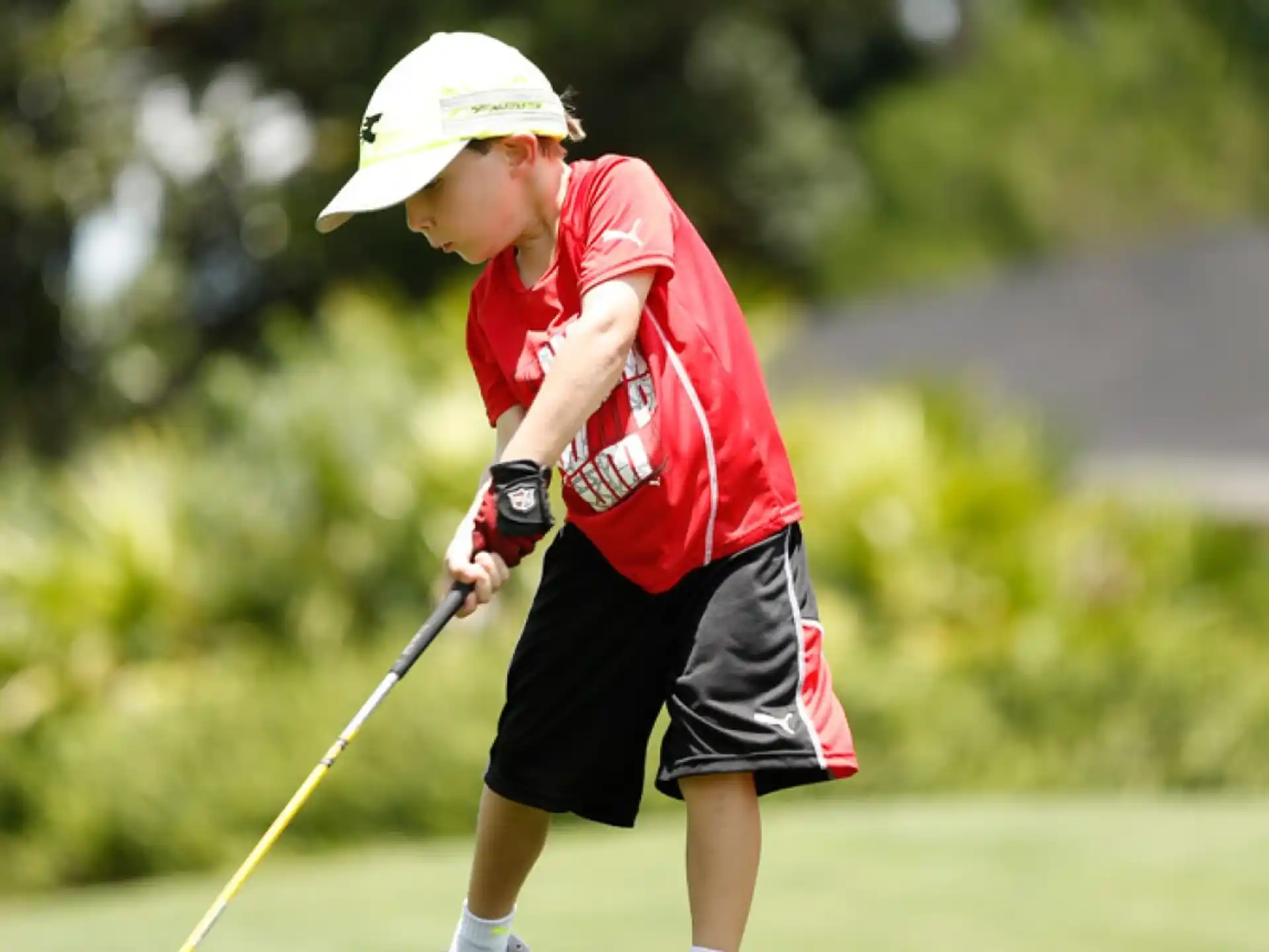 a boy playing golf