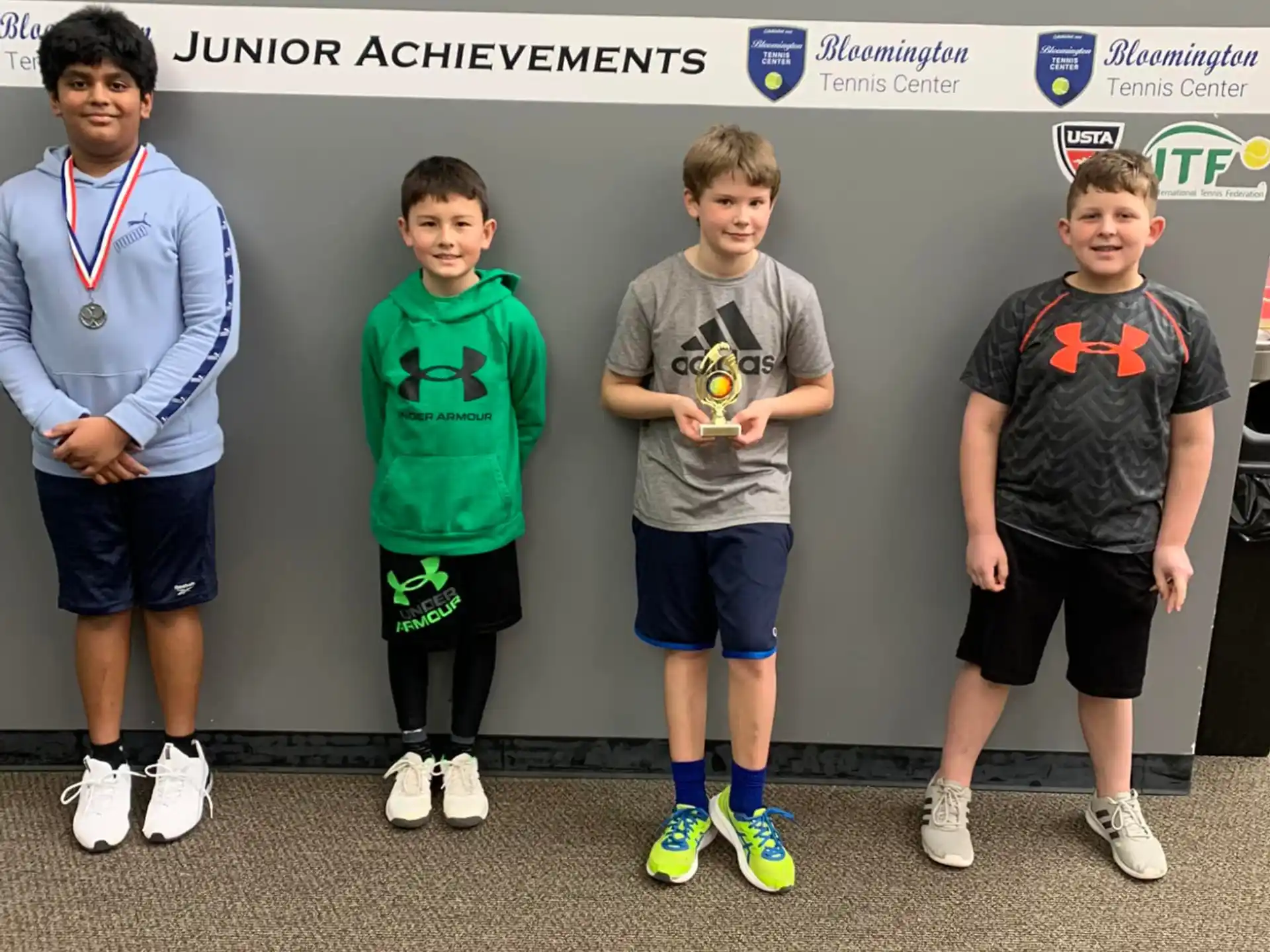 a group of boys posing for a picture