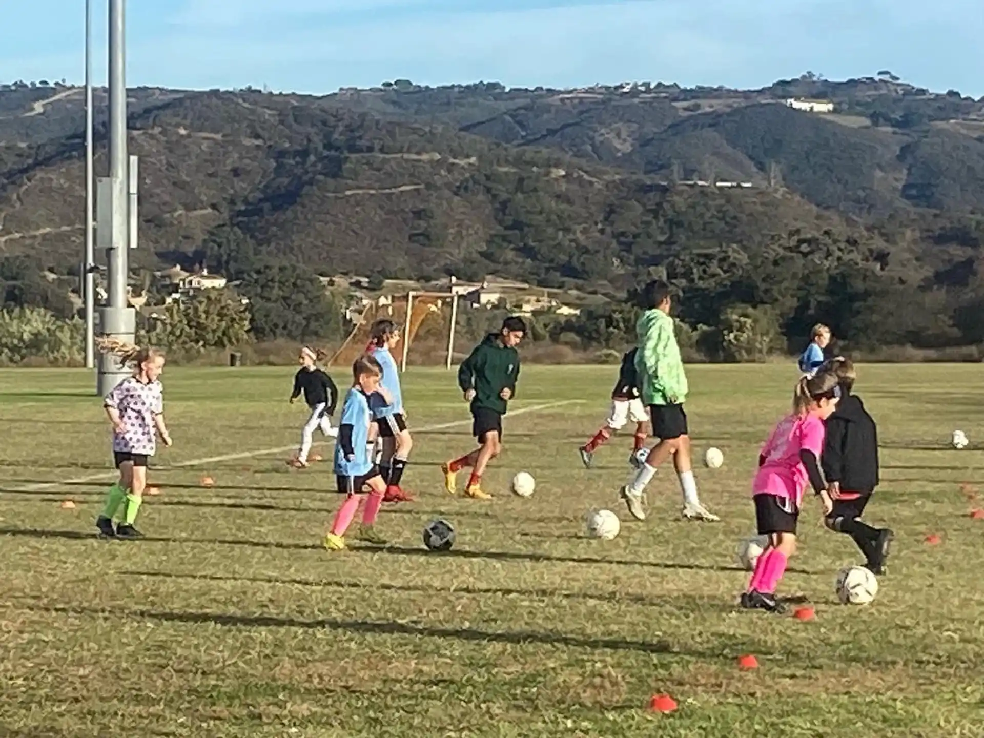 a group of kids playing football