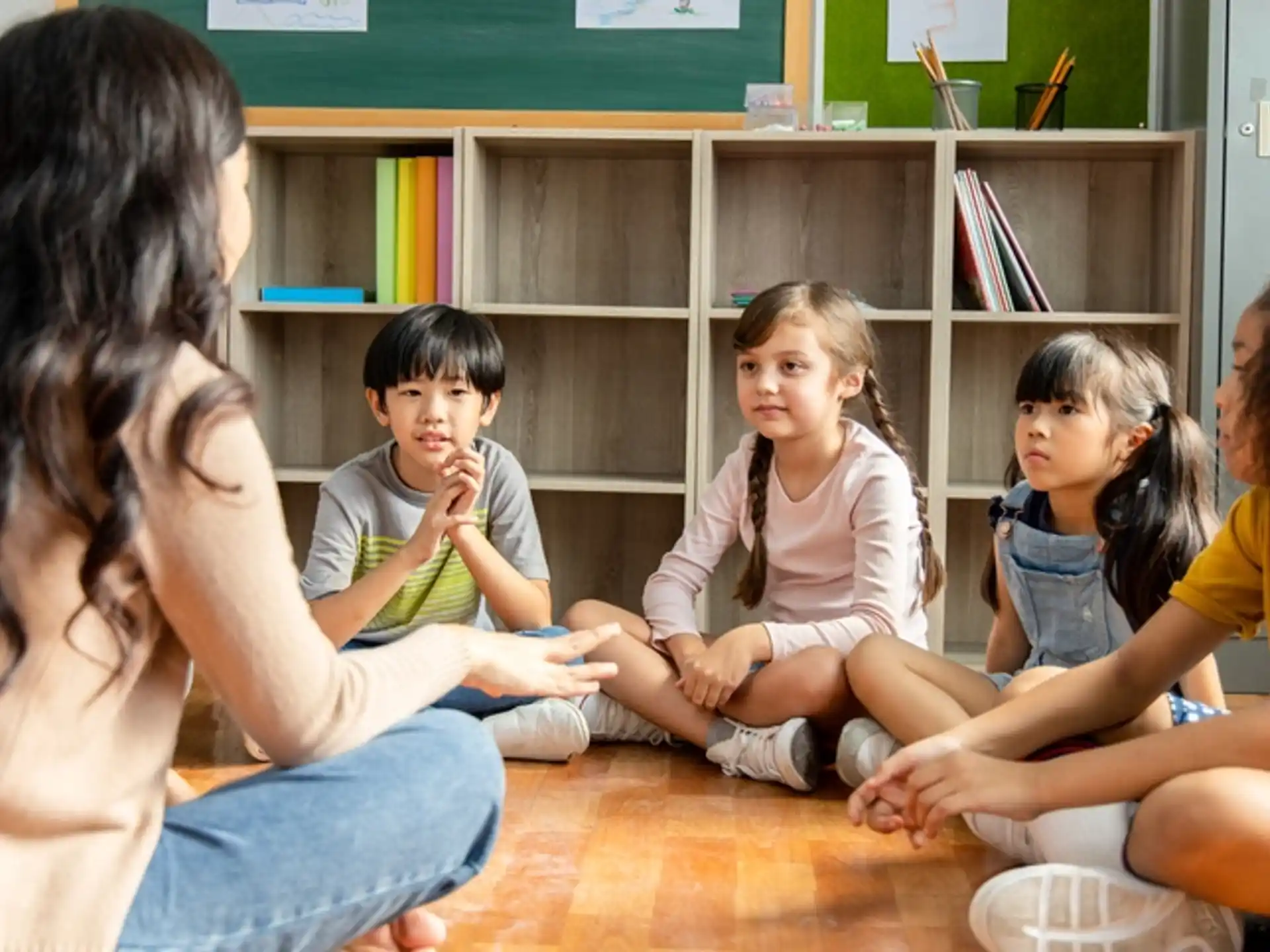 a group of children sitting on the floor