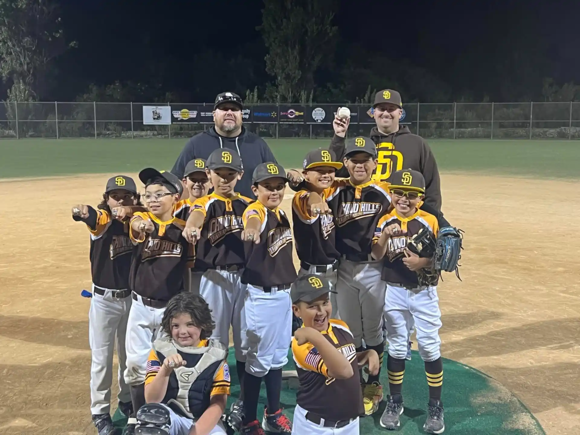 a group of baseball players posing for a photo