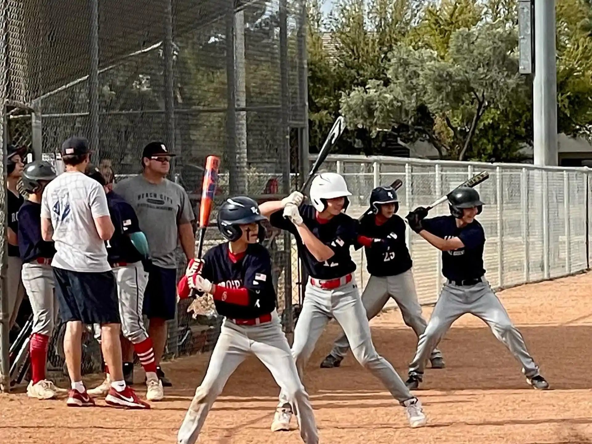 a group of people playing baseball