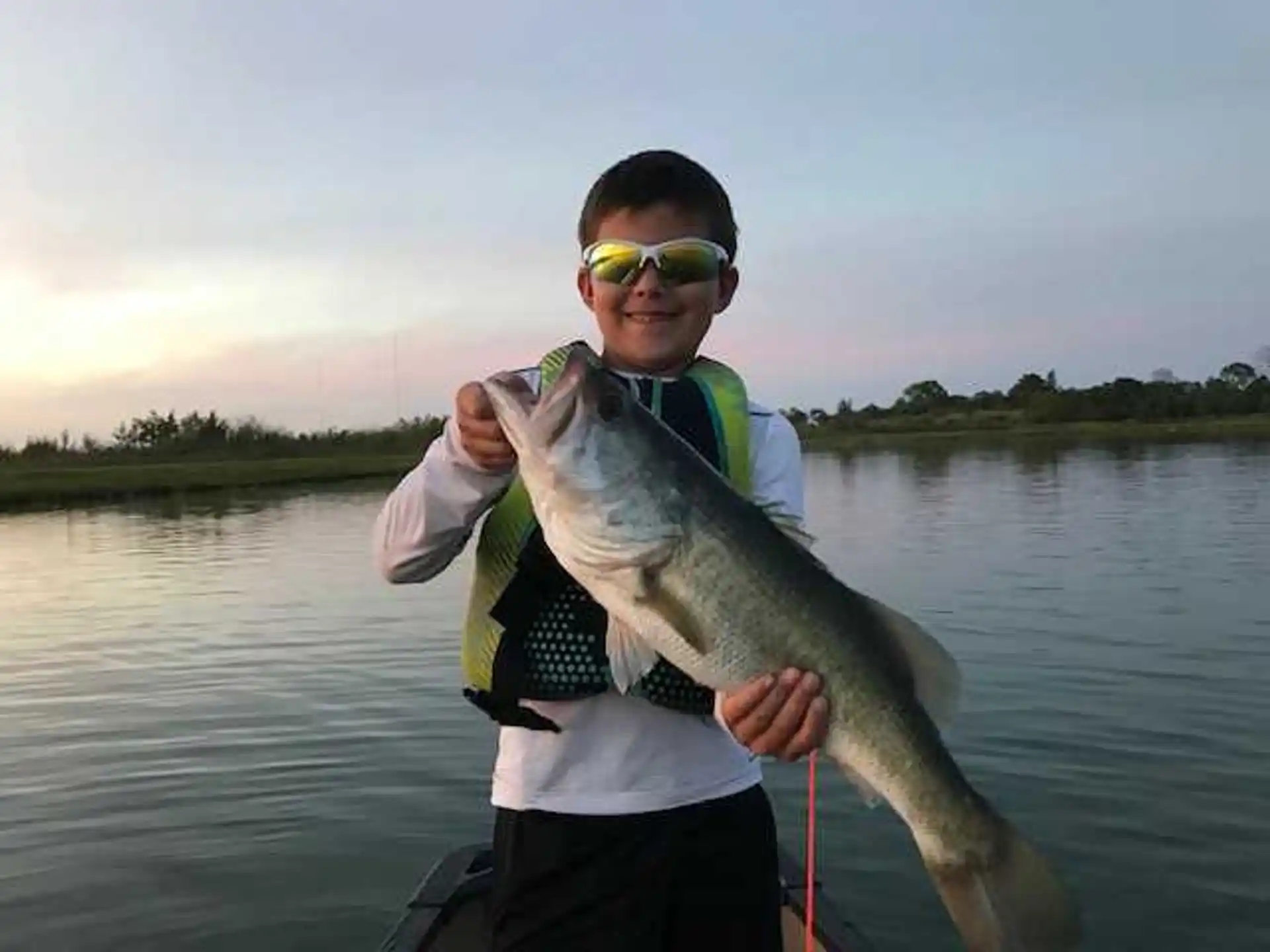 a man holding a fish