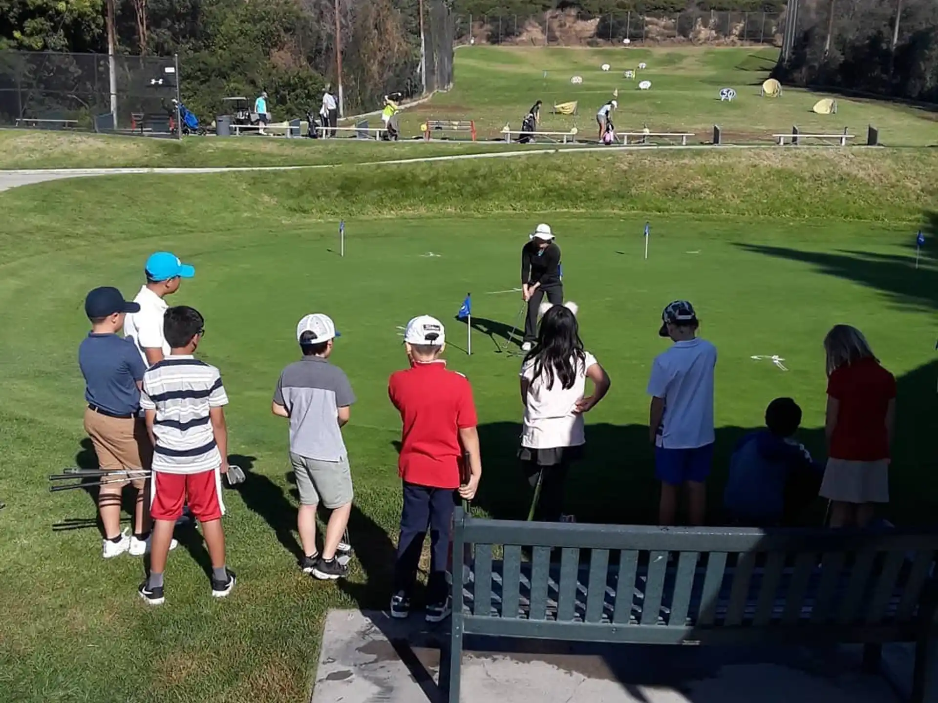 a group of people on a golf course