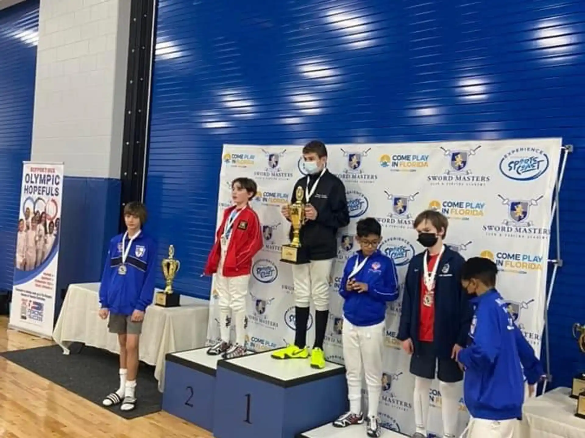 a group of people standing on a podium